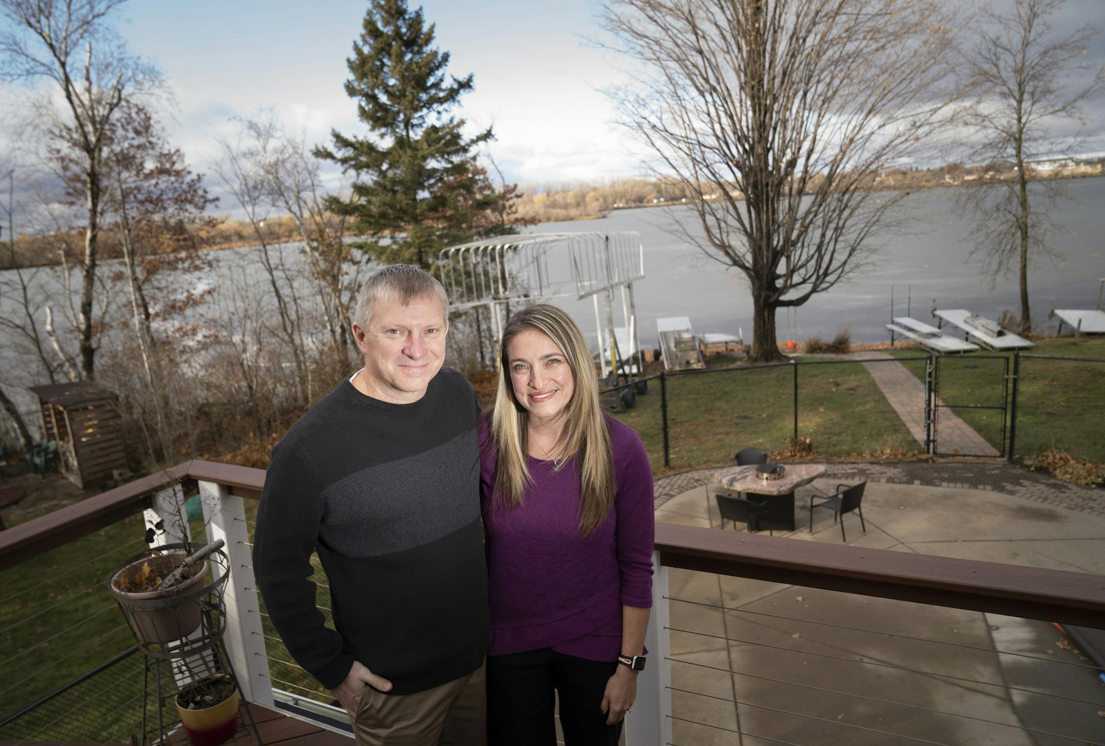 Kurt and Lindsey Carpenter posed for a photo on their deck that overlooks Goose Lake in White Bear Lake, Minn., on Thursday, November 21, 2019. The couple, who are avid water skiers, is fighting back against proposal to ban boats from Goose Lake for three years.] RENEE JONES SCHNEIDER &#x2022; renee.jones@startribune.com