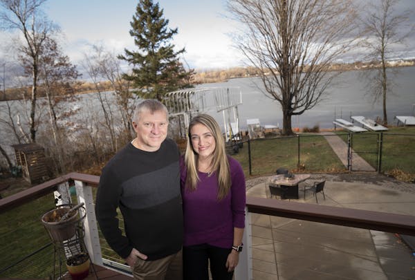 Kurt and Lindsey Carpenter posed for a photo on their deck that overlooks Goose Lake in White Bear Lake, Minn., on Thursday, November 21, 2019. The co