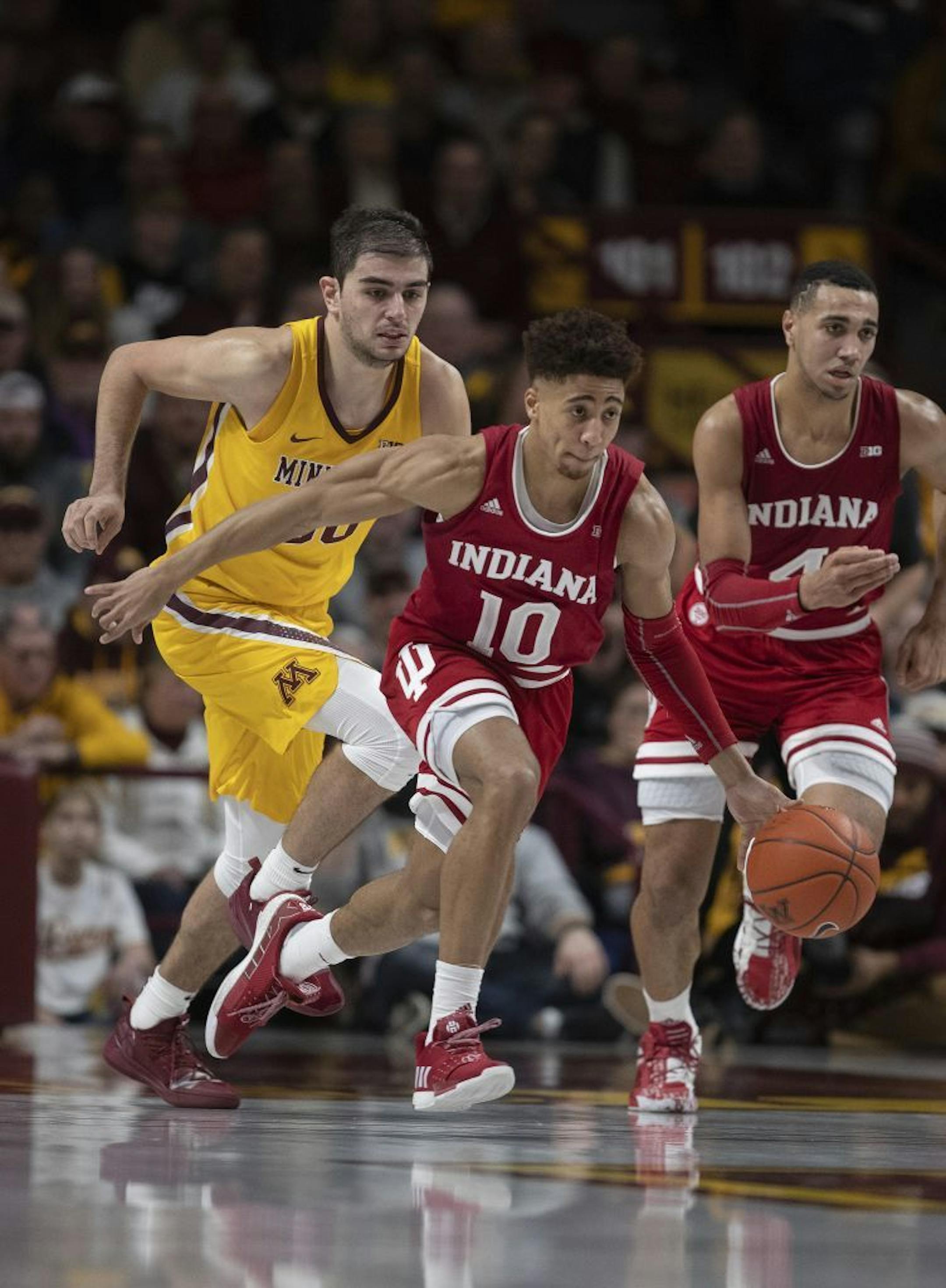 Indiana Hoosiers guard Rob Phinisee (10) dribble the ball down court after stealing it from Minnesota Gophers forward Alihan Demir (30) in the second half.
