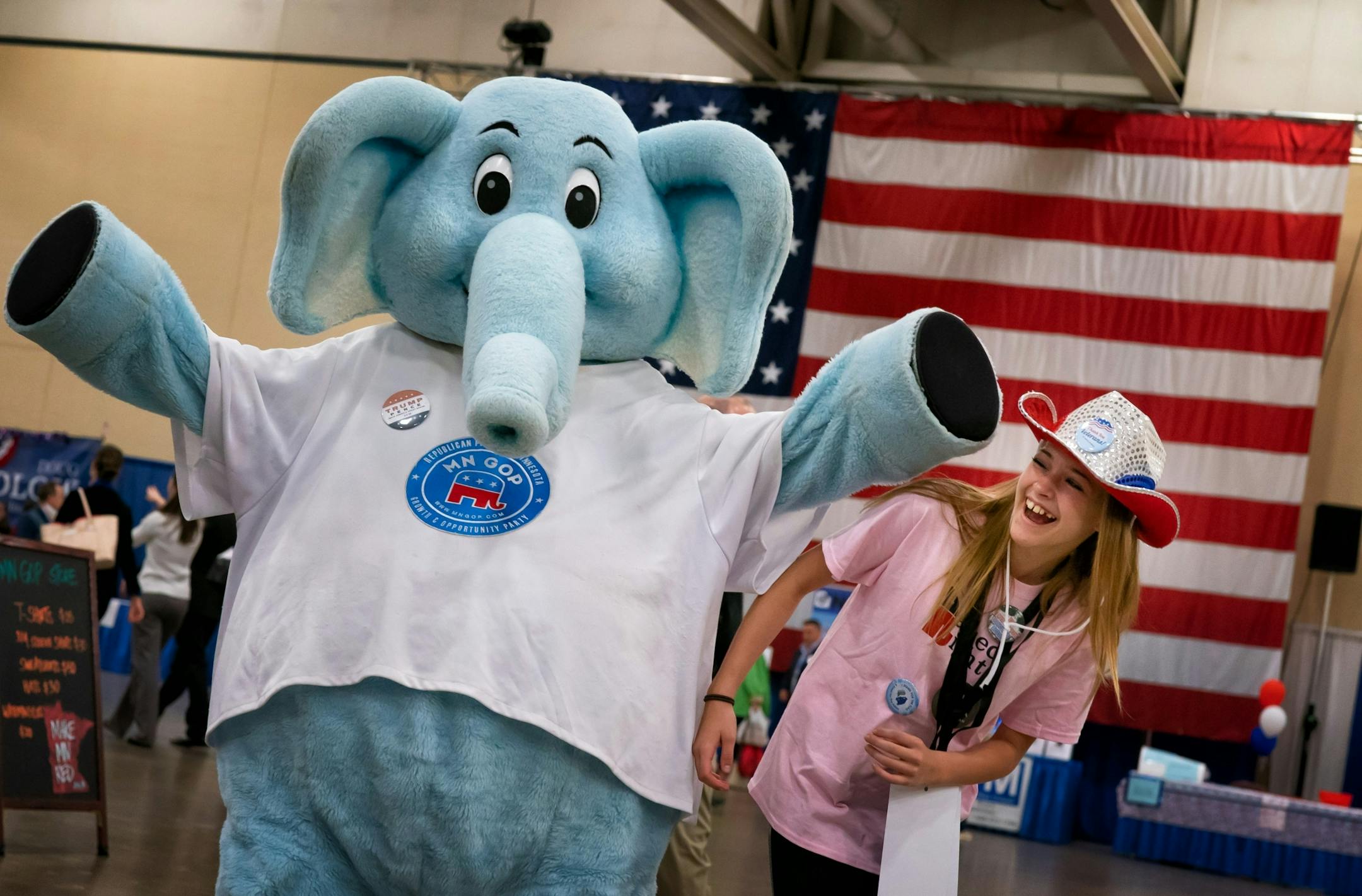 Sydney Schmidt, 13, got the job of handling her brother Alex, 15 as he brought life to GOP mascot Ernie the Elephant the Republican state convention in Duluth. Unfortunately here Ernie accidentally knocked his sister in the head as he posed for a photograph.