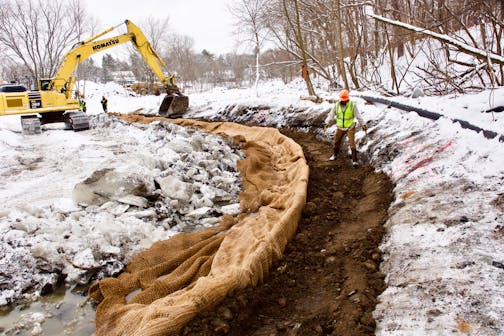 Workers installed "soil burritos'' to restore Minnehaha Creek's natural curves in St. Louis Park, part of a project to improve water quality and renew wetlands that store and purify stormwater.