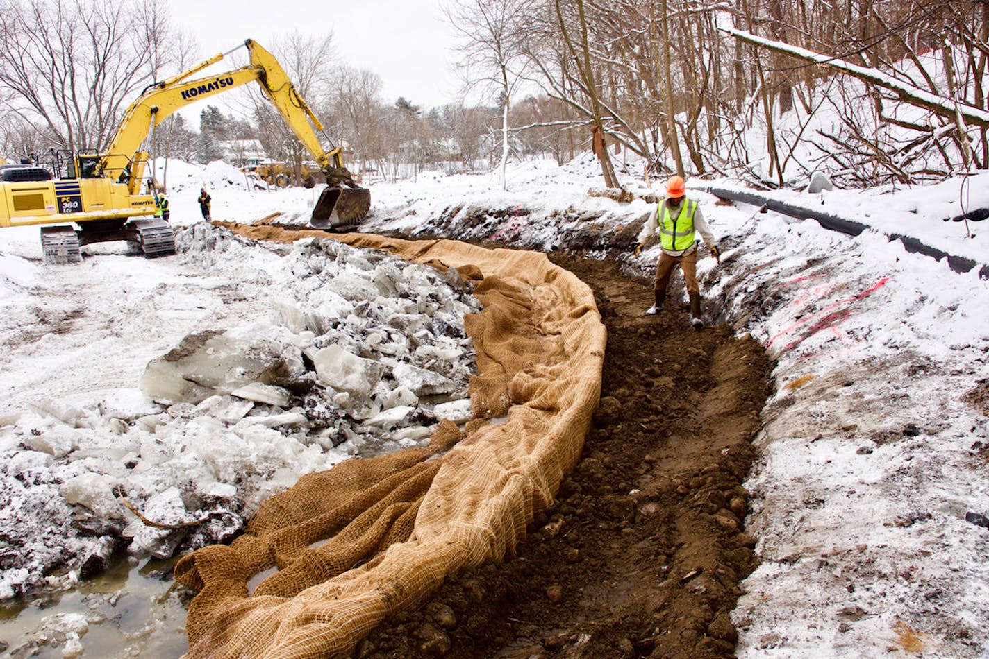 Workers installed "soil burritos'' to restore Minnehaha Creek's natural curves in St. Louis Park, part of a project to improve water quality and renew wetlands that store and purify stormwater.