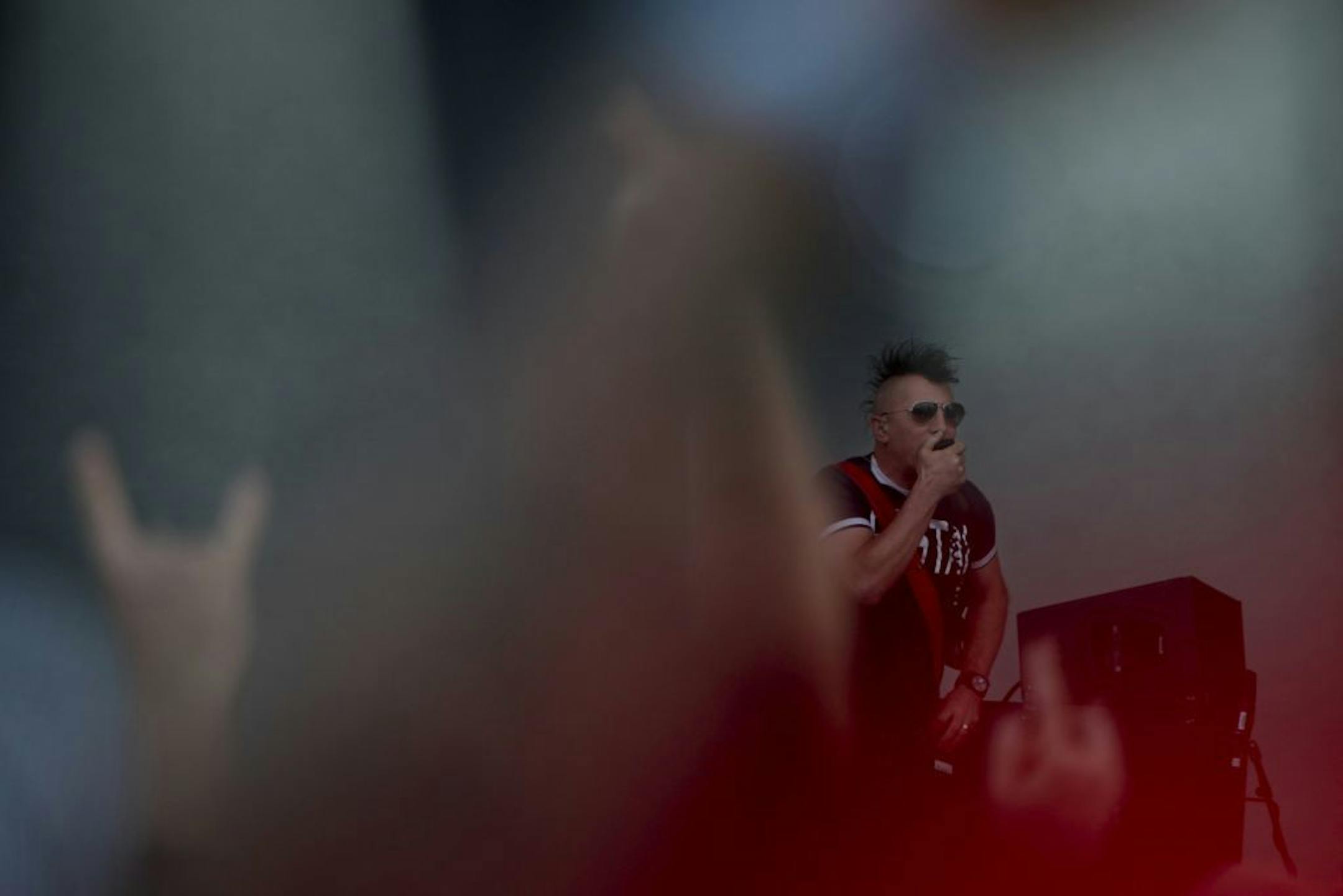 Closing the evening, lead singer of Tool Maynard James Keenan sings to his audience at the first annual River Festival at Harriet Island in St. Paul, Minn. on Saturday June 23, 2012.