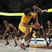 Gophers forward Jordan Murphy (3) turned to shoot while defended by Maryland Terrapins forward Jalen Smith (25).