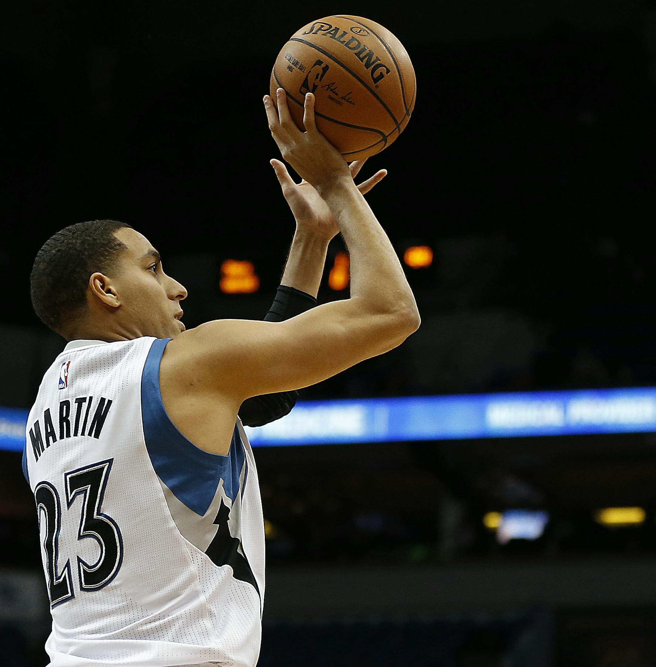 Minnesota Timberwolves guard Kevin Martin (23) shoots the ball against Philadelphia 76ers center Nerlens Noel (4) in the first half of an NBA basketball game Monday, Nov. 23, 2015 in Minneapolis. The Timberwolves won 100-95. (AP Photo/Stacy Bengs)