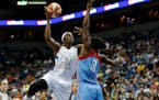 Minnesota Lynx center Sylvia Fowles (34) shoots the ball against Atlanta Dream forward Aneika Henry (13) during the first half of a WNBA basketball ga