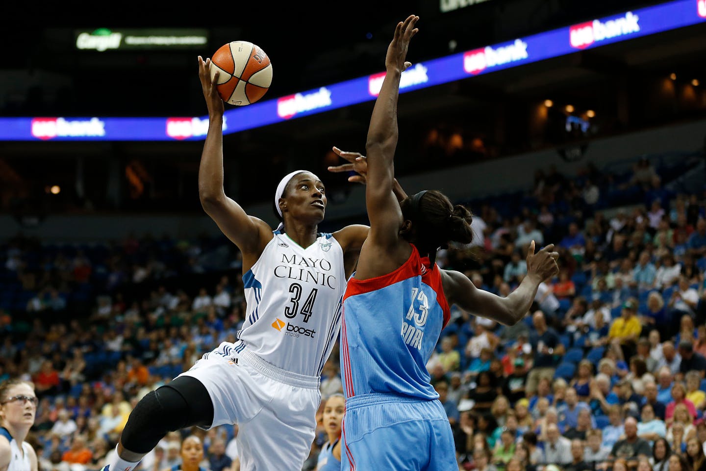 Minnesota Lynx center Sylvia Fowles (34) shoots the ball against Atlanta Dream forward Aneika Henry (13) during the first half of a WNBA basketball game, Friday, July 31, 2015, in Minneapolis. (AP Photo/Stacy Bengs)