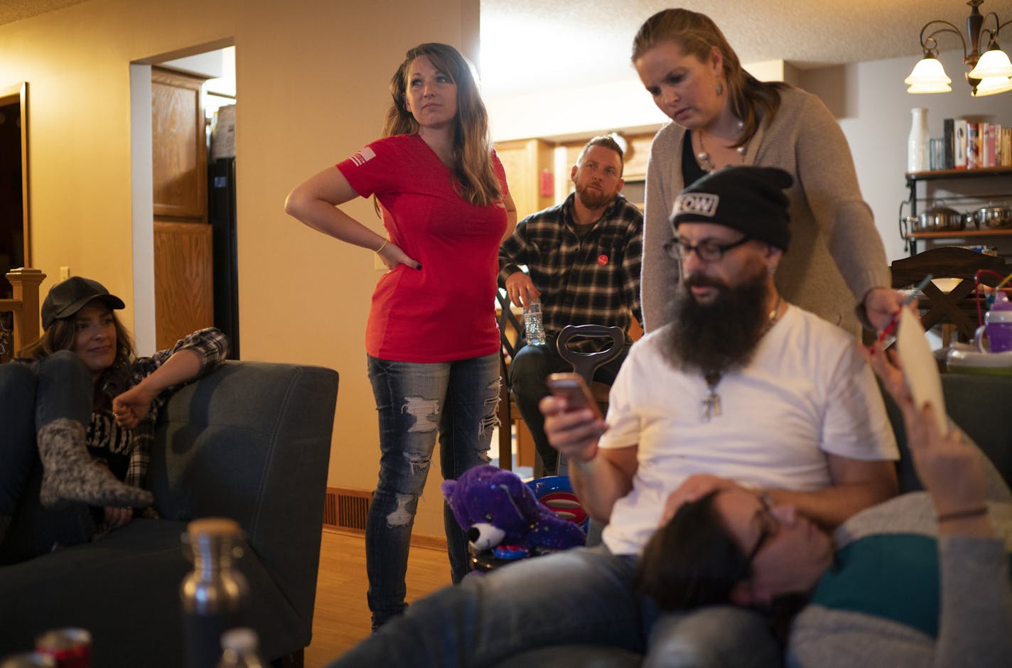 Amanda Garcia, center, watched returns with her friends and family Tuesday night. The others are, from left, Beth Dordal, Garcia, Jon Dordal, Mary L., Steven Nagy, and Sara Linert. ] JEFF WHEELER • jeff.wheeler@startribune.com Amanda Garcia, a supporter of President Donald Trump, watched election returns with friends and family at her home in Apple Valley Tuesday night, November 3, 2020.