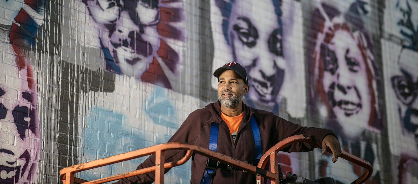 Profile of artist Peyton Scott Russell as he works on a elaborate mural at City of Lakes Community Land Trust that utilizes stencils that people created of themselves .] Jerry Holt •Jerry.Holt@startribune.com Profile of artist Peyton Scott Russell, who painted the massive George Floyd piece at 38th and Chicago. Russell is currently working on beautiful, elaborate mural at City of Lakes Community Land Trust that utilizes stencils that people created of themselves Thursday September 10,2020 in Min