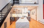 This warehouse loft condo in the North Loop was recently redesigned by Albertsson Hansen Architecture.