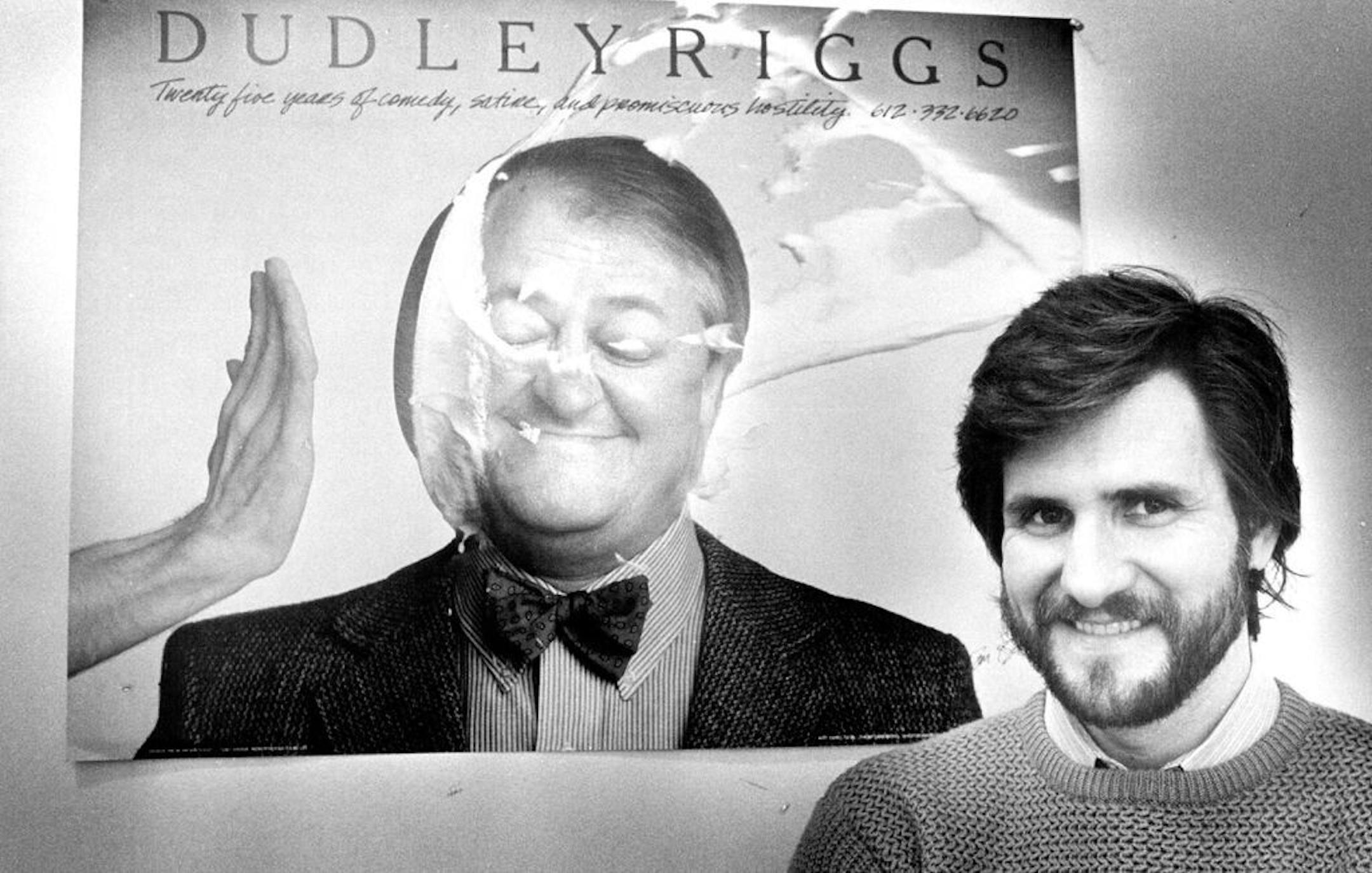 February 1984: Tom Berthiaume stood next to his poster showing theatrical producer Dudley Riggs on the receiving end of a cream pie.