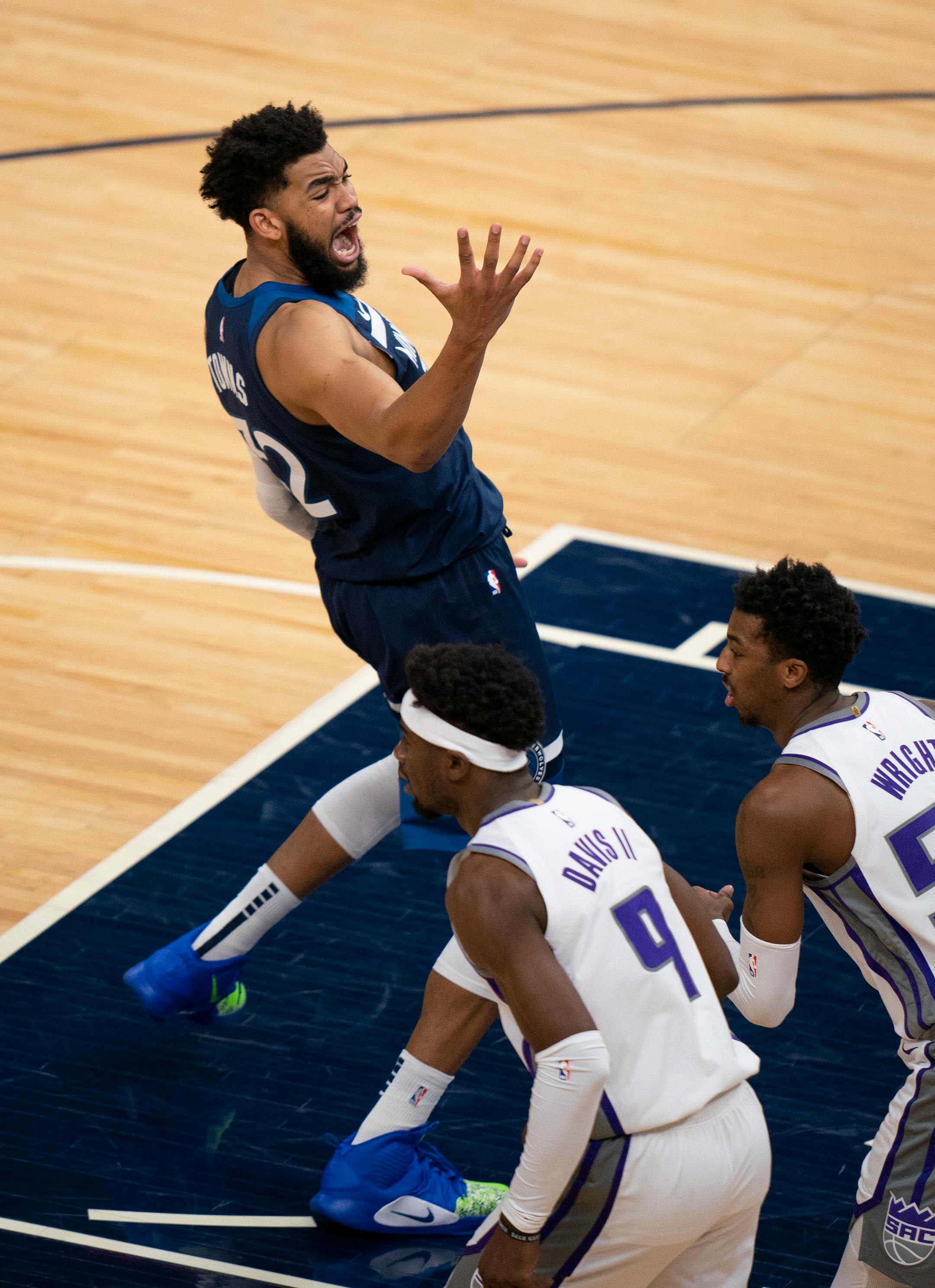 Minnesota Timberwolves center Karl-Anthony Towns (32) reacted after missing a third quarter shot.