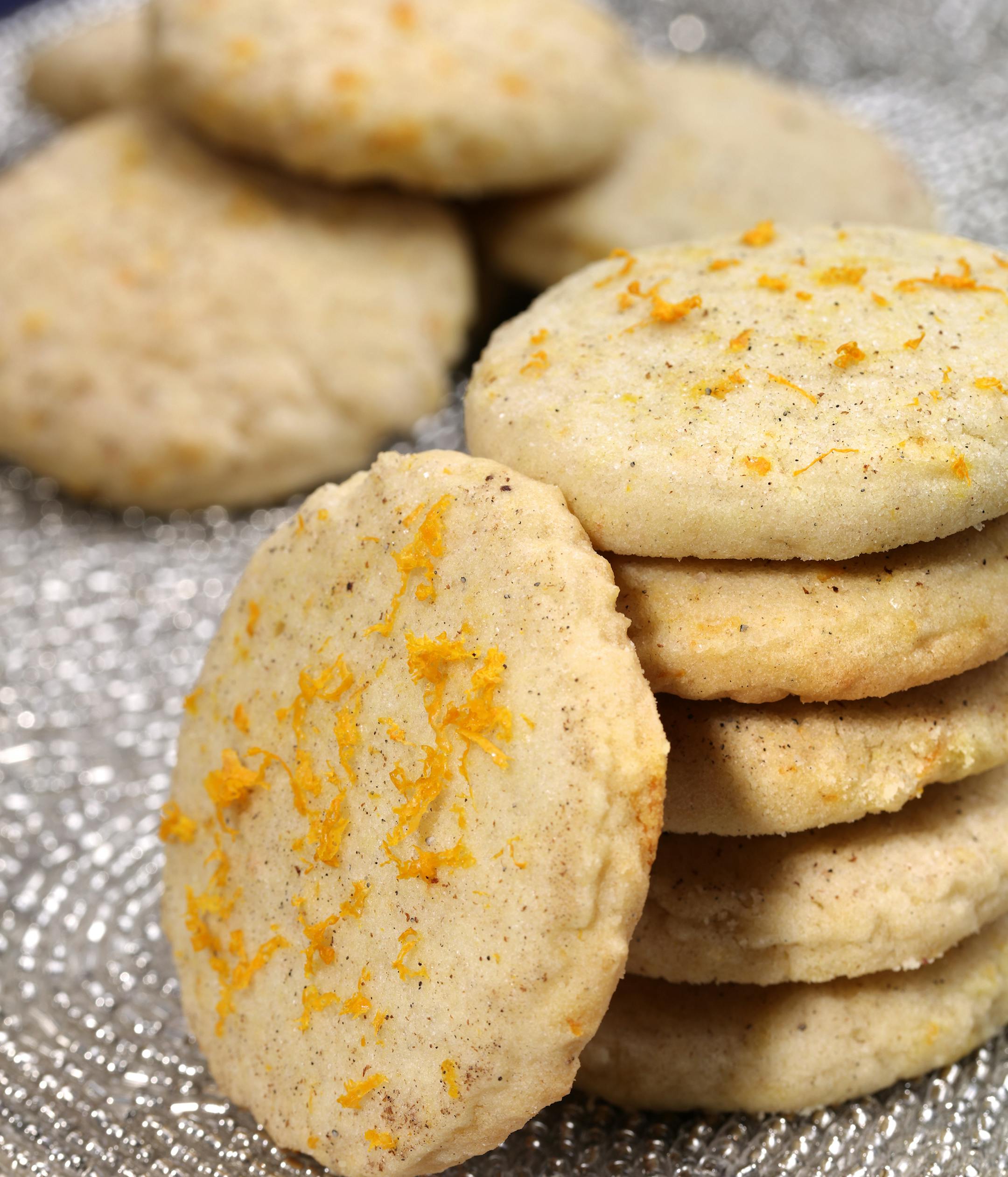 Cardamom Orange Zest Sugar Cookies (from baker Jeanne Nordstrom) ] The winner and four finalists in the 2015 Taste Holiday Cookie (Cooky) Contest: Chocolate Decadence Cookies (from baker Elaine Prebonich), Kit Kat Christmas Bars (from baker Julie Olson), Cardamom Orange Zest Sugar Cookies (from baker Jeanne Nordstrom), Bacon Cornmeal Venetos (by bakers Julie Bollmann, Wendy Kleiser, Joan Koller, Geri Olson and Mary Urbas) and winner Apple Cardamom Pecan Star Cookies (from baker Jana Freiband).