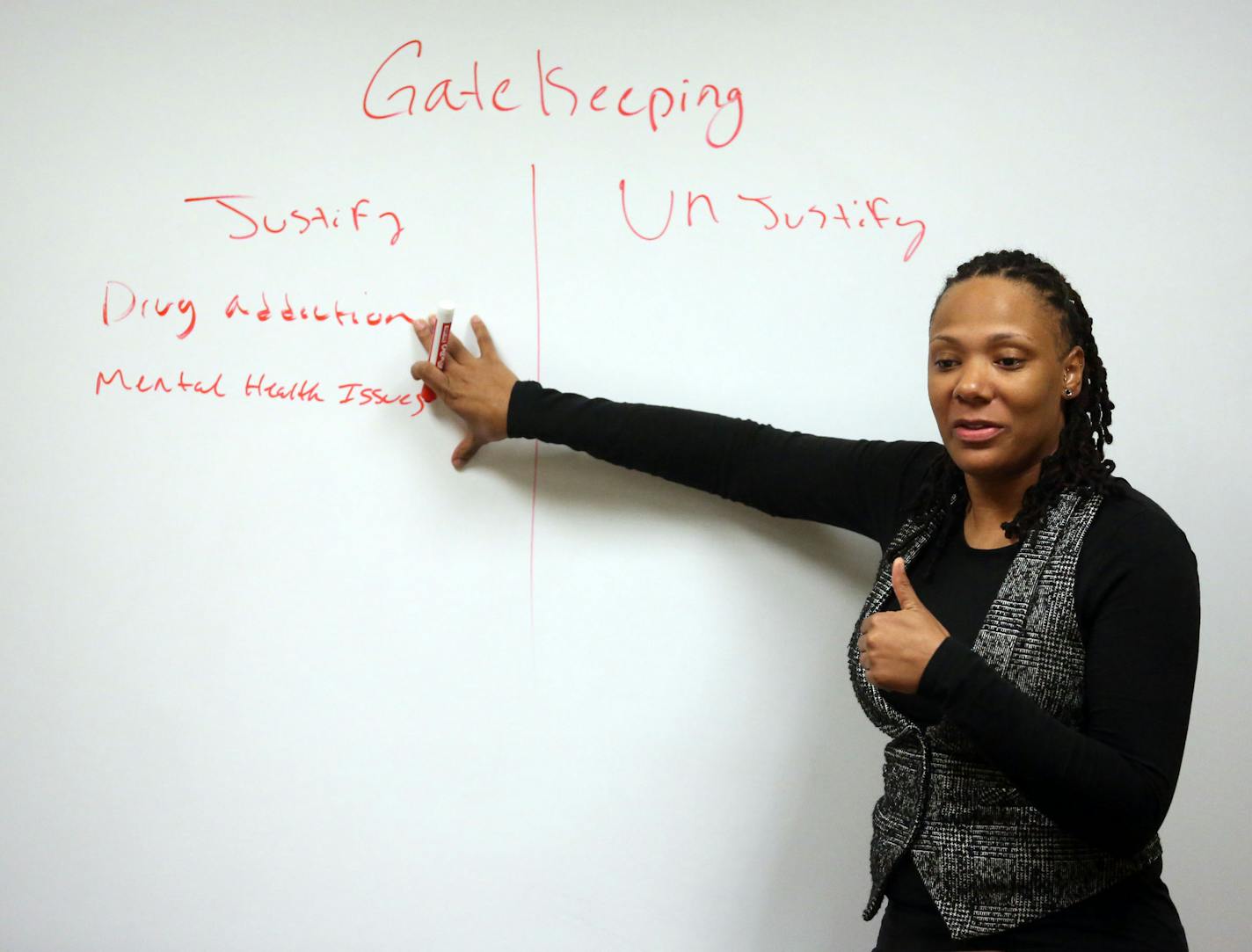 Instructor Maisha Giles talked about being gatekeepers for your children and how that might effect the relationship with the other parent with some of the fathers during the fourth of a series of co-parenting classes sponsored in part by Hennepin County in Minneapolis Tuesday, December 10, 2013 ] (KYNDELL HARKNESS/STAR TRIBUNE) kyndell.harkness@startribune.com