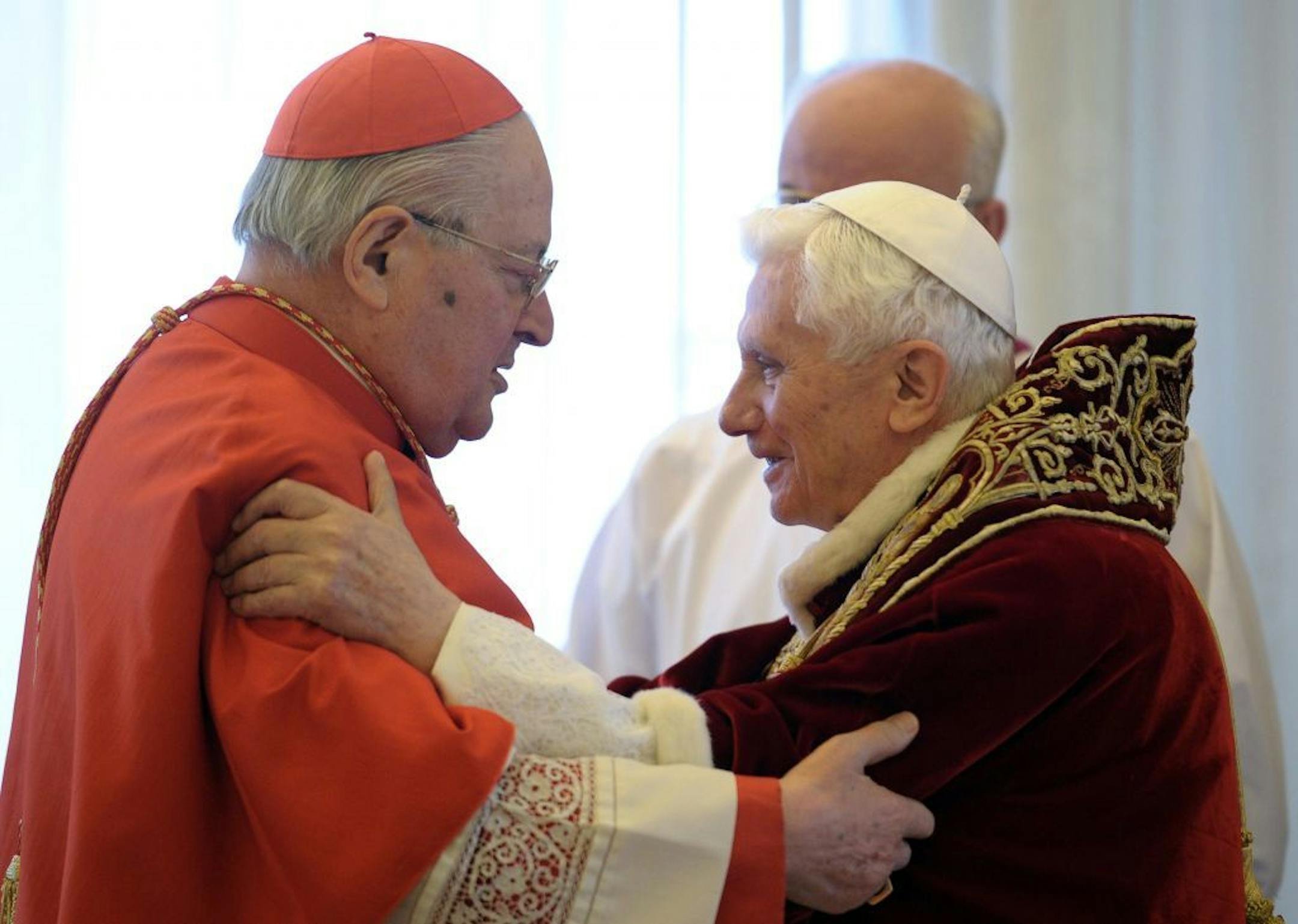 In this photo provided by the Vatican newspaper L'Osservatore Romano, Pope Benedict XVI, right, and Cardinal Angelo Sodano, Dean of the College of Cardinals, hug each other after the pontiff announced during the meeting of Vatican cardinals that he would resign on Feb. 28, at the Vatican, Monday, Feb. 11, 2013. Benedict XVI announced Monday that he would resign Feb. 28 - the first pontiff to do so in nearly 600 years. The decision sets the stage for a conclave to elect a new pope before the end
