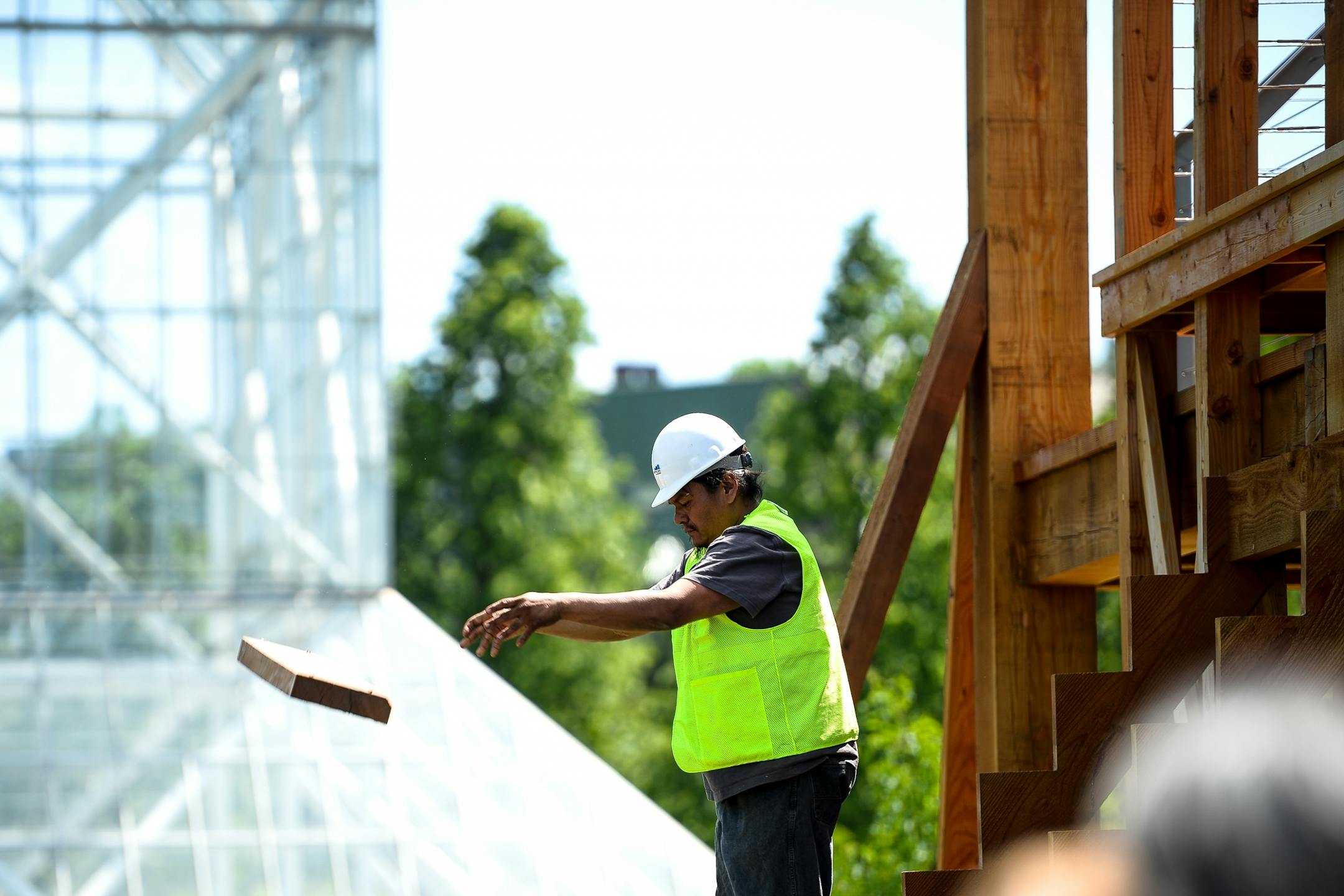 Brian LaBatte, a Lakota and Dakota from Cheyenne River, tossed one of the pieces removed from the "Scaffold" Sculpture as its demolishment began Friday. Staight Line construction