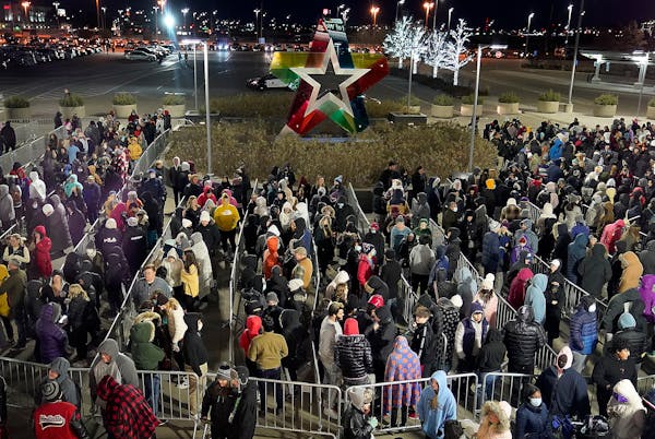 Image of a large crowd of Black Friday shoppers wait outside the Mall of America's north entrance for the doors to open at 7 a.m. Friday, Nov. 26, 202