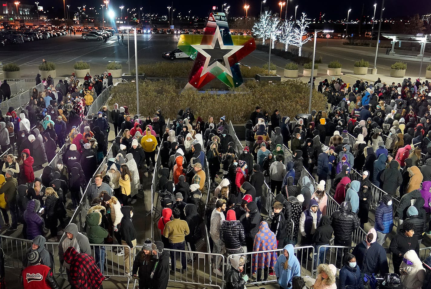 Image of a large crowd of Black Friday shoppers wait outside the Mall of America's north entrance for the doors to open at 7 a.m. Friday, Nov. 26, 2021 in Bloomington, Minn.