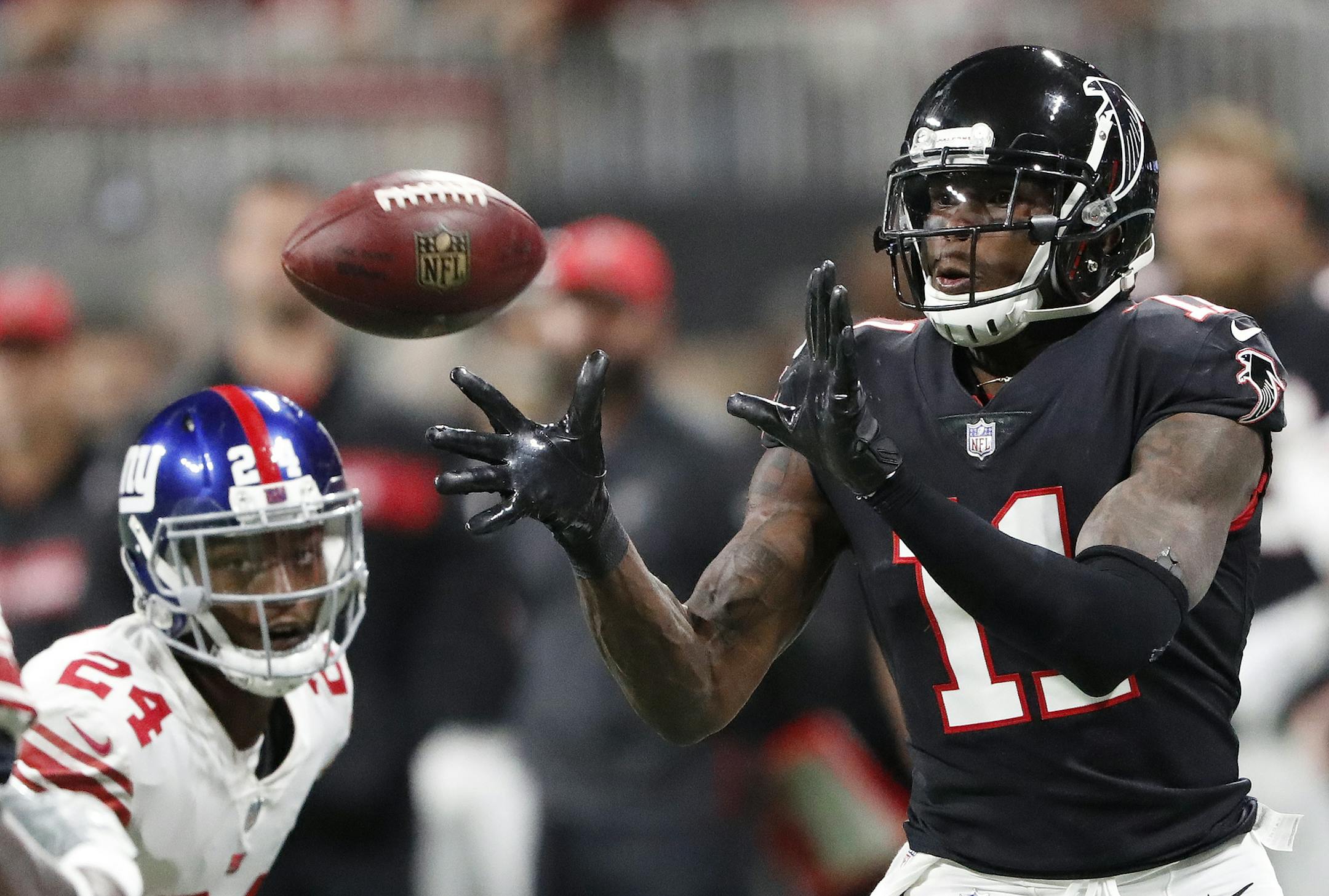 Atlanta Falcons wide receiver Julio Jones (11) prepares to make the catch as New York Giants cornerback Eli Apple (24) defends during the first half of an NFL football game, Monday, Oct. 22, 2018, in Atlanta. (AP Photo/John Bazemore)