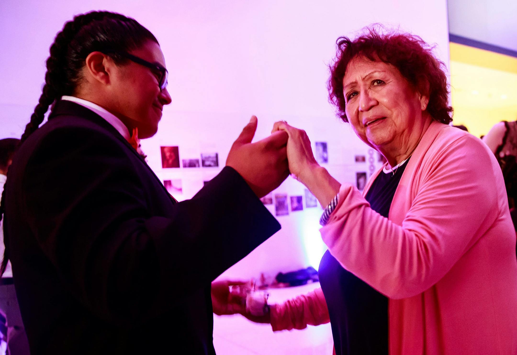 Recent graduate Juan "Neeto" Old Chief Betancourt dances with his great-grandmother Marie Antone, 74, during the Chief Sealth International High School CQ prom at the Seattle Art Museum in June. Betancourt, a captain of the football team, requested Shania Twain's "Man! Feel Like a Woman!" for a special dance with his great-grandmother. Antone is a fan of country music. (Erika Schultz/Seattle Times/TNS)