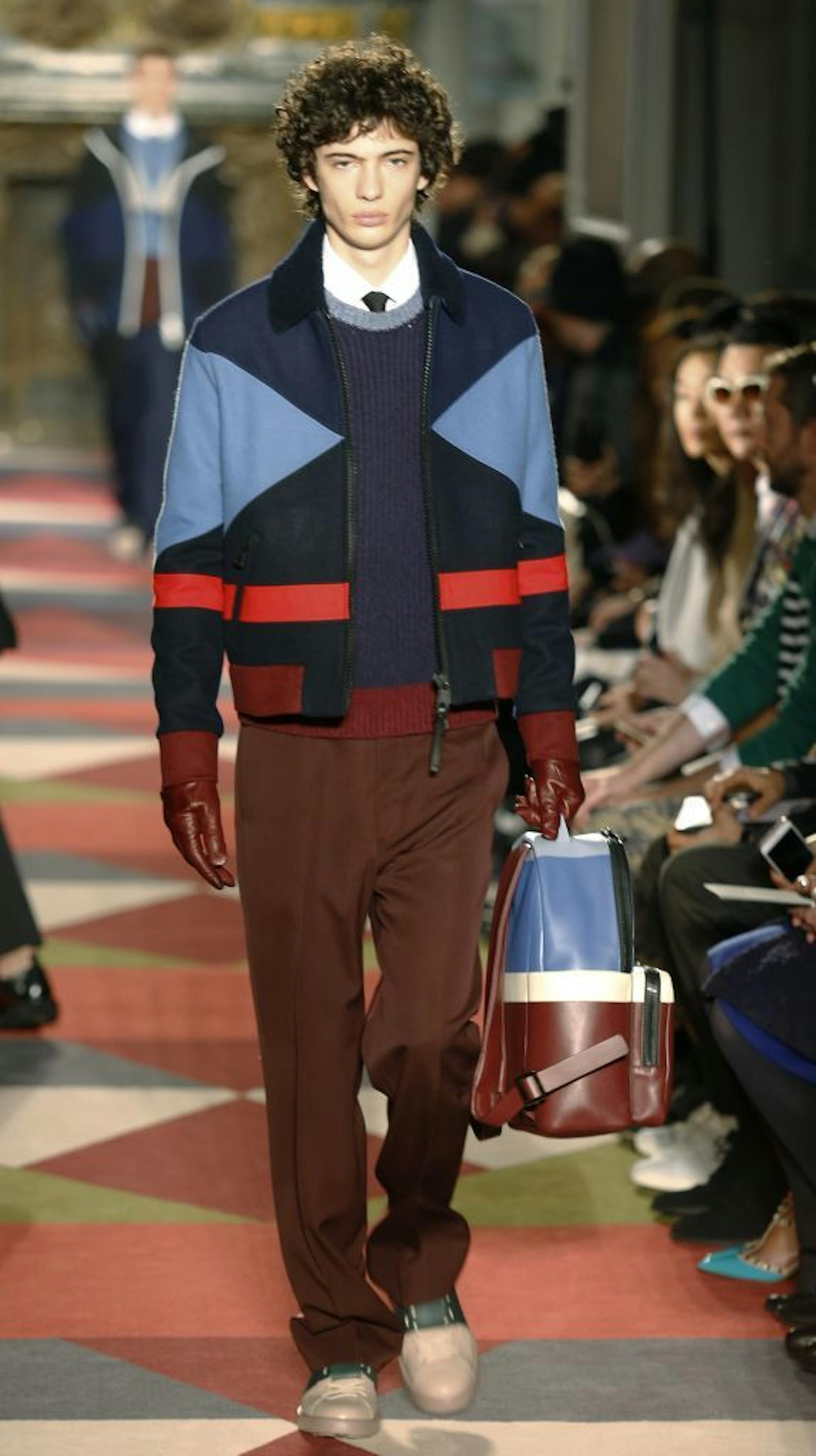 In this Jan. 21, 2015, file photo, a model wears a creation by designer Valentino that shows one of the two colors of the year, Serenity, a shade that is closer to baby blue.