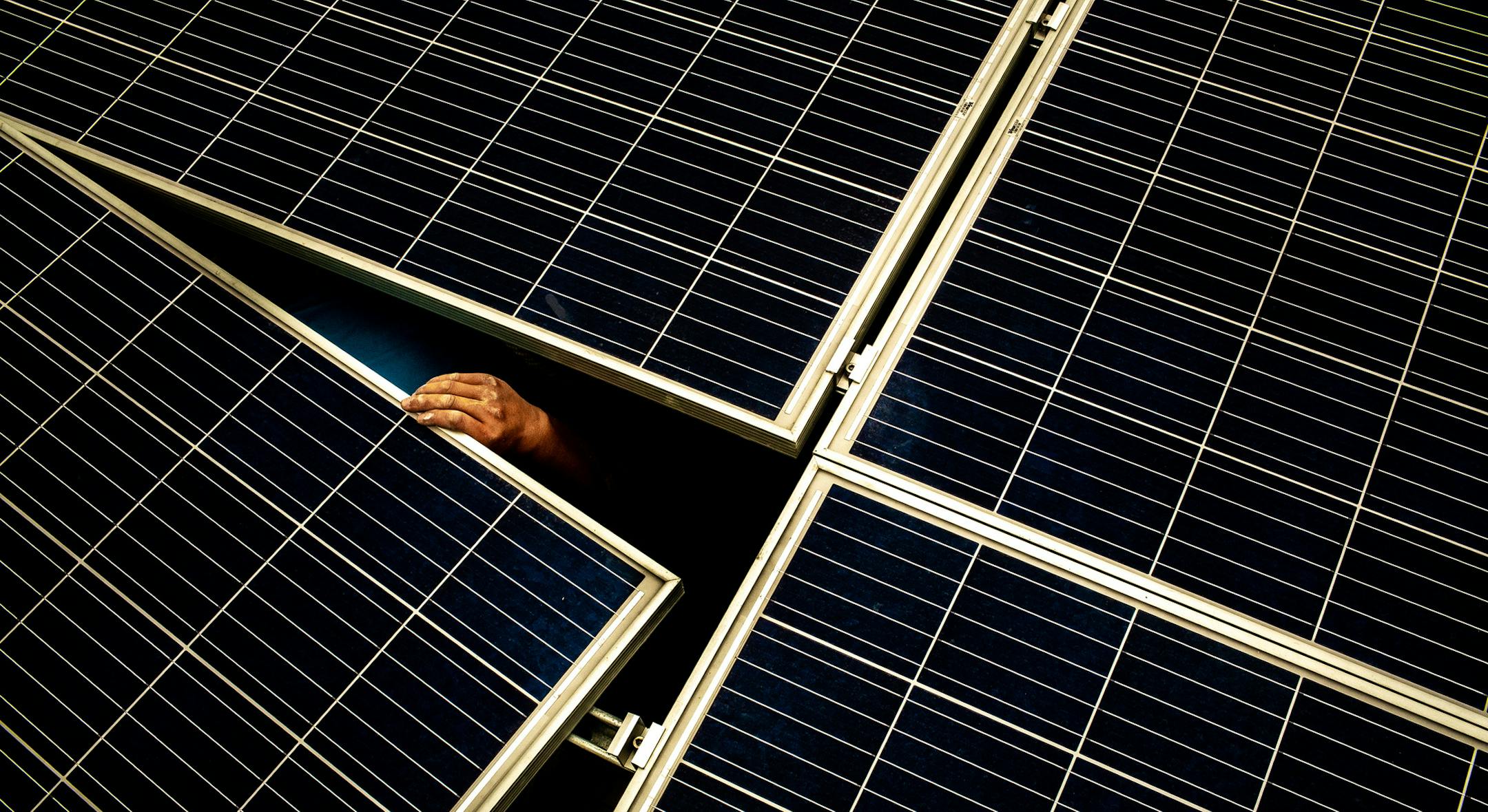 A worker installs solar panels on a 47-story residential development in Wuhan in the Hubei province of China, June 5, 2018. The West was sure the Chinese approach would not work. It just had to wait. It’s still waiting. (Bryan Denton/The New York Times)