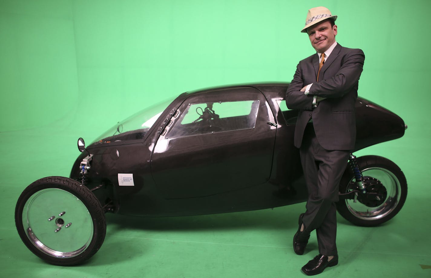 Rich Kronfeld, of Golden Valley, stood in front the Rahtmobile, an abbreviation of Recumbent Automotive Human Transport, that electric-powered, enclosed tricycle whose batteries can be recharged by pedaling at a television studio in St. Paul, Min., Tuesday, June 11, 2013. Kronfeld, the main developer, said that the Rahtmobile goes at least 45 miles per hour, and seems like a cross between a motorcycle and a car ] (KYNDELL HARKNESS/STAR TRIBUNE) kyndell.harkness@startribune.com