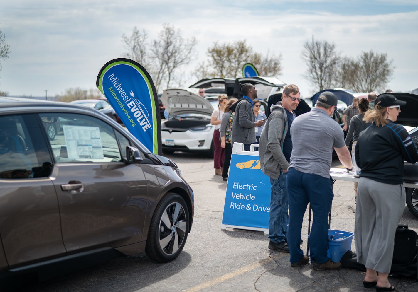 Energy and electric vehicle showcase at the MPCA in St Paul. People were invited to talk to EV auto dealers, test drive electric vehicles, see an electric school bus, and learn about electric bicycles, rooftop solar systems, etc. ] GLEN STUBBE • glen.stubbe@startribune.com Wednesday, April 24, 2019 This is a Sunday story about what a zero-carbon transportation future looks like in Minnesota. What's Happening at this time: Memebers of the public test driving an electric car at this MPCA event: "E