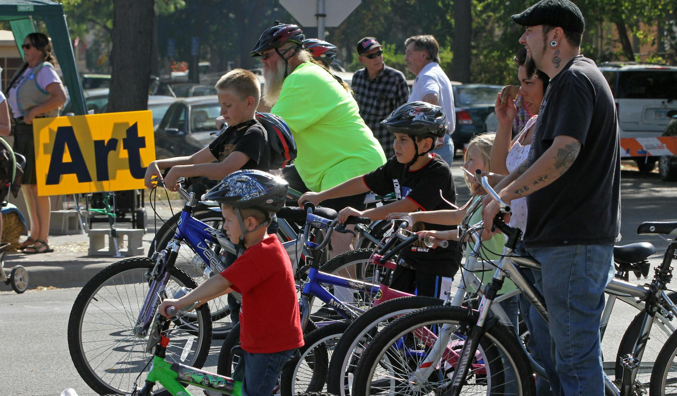 Bikers rode through a closed Lowery Ave North in Minneapolis during the Lowry Open Streets Minneapolis 2012 Harvest Fest. The one day event was sponsored by the Minneapolis Bicycle Coalition and the Lowry Corridor Business Association and featured community arts activities, food, live music, a car show and bike activities spread over 24 blocks on Lowry Ave on 9/29/12.] Bruce Bisping/Star Tribune bbisping@startribune.com ORG XMIT: MIN1209291614451291