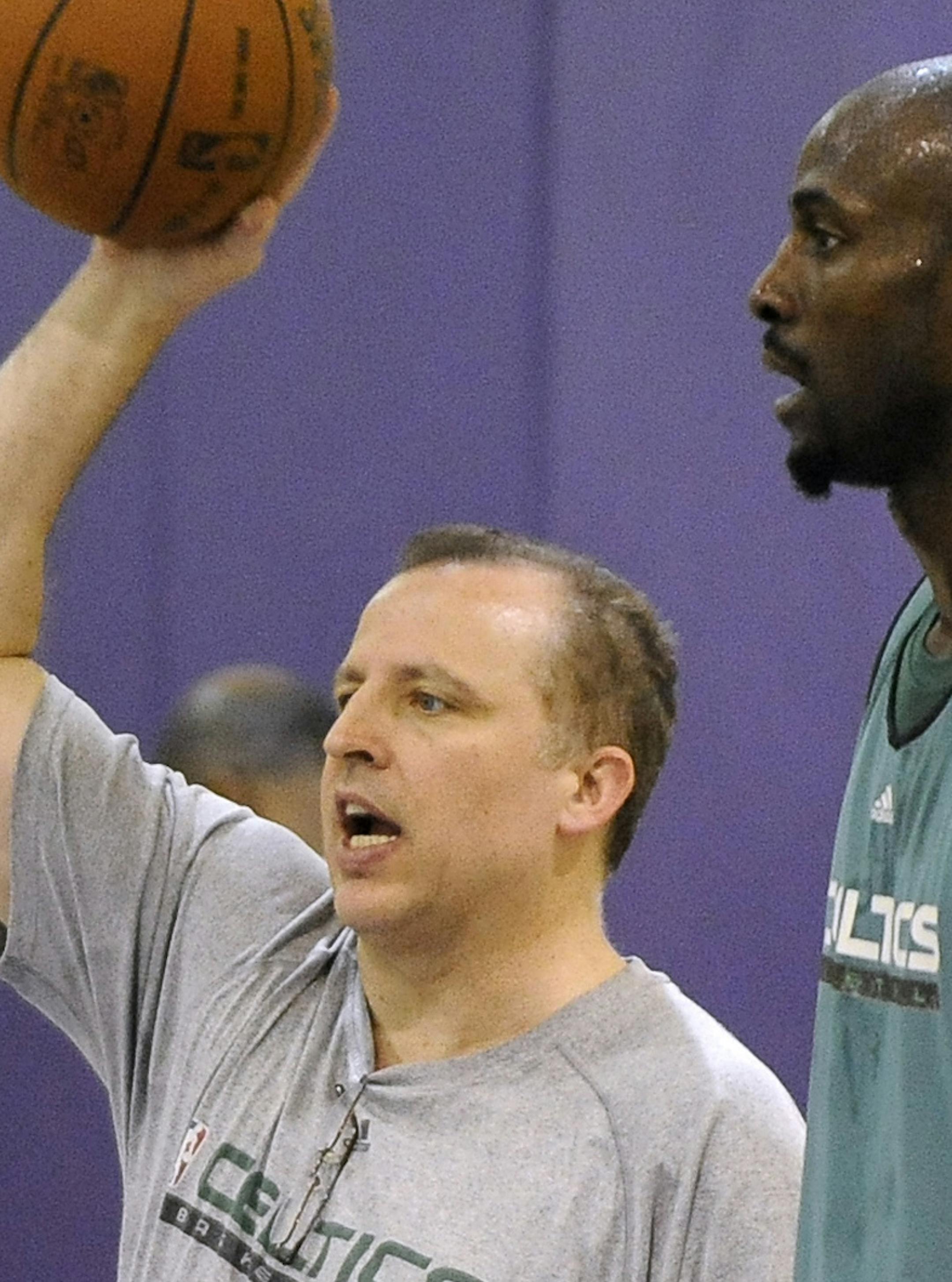 Boston Celtics assistant coach Tom Thibodeau, left, gives instructions as forward Kevin Garnett looks on during practice, Saturday, June 5, 2010, in El Segundo, Calif. for the NBA basketball finals. (AP Photo/Mark J. Terrill) ORG XMIT: CAMT102