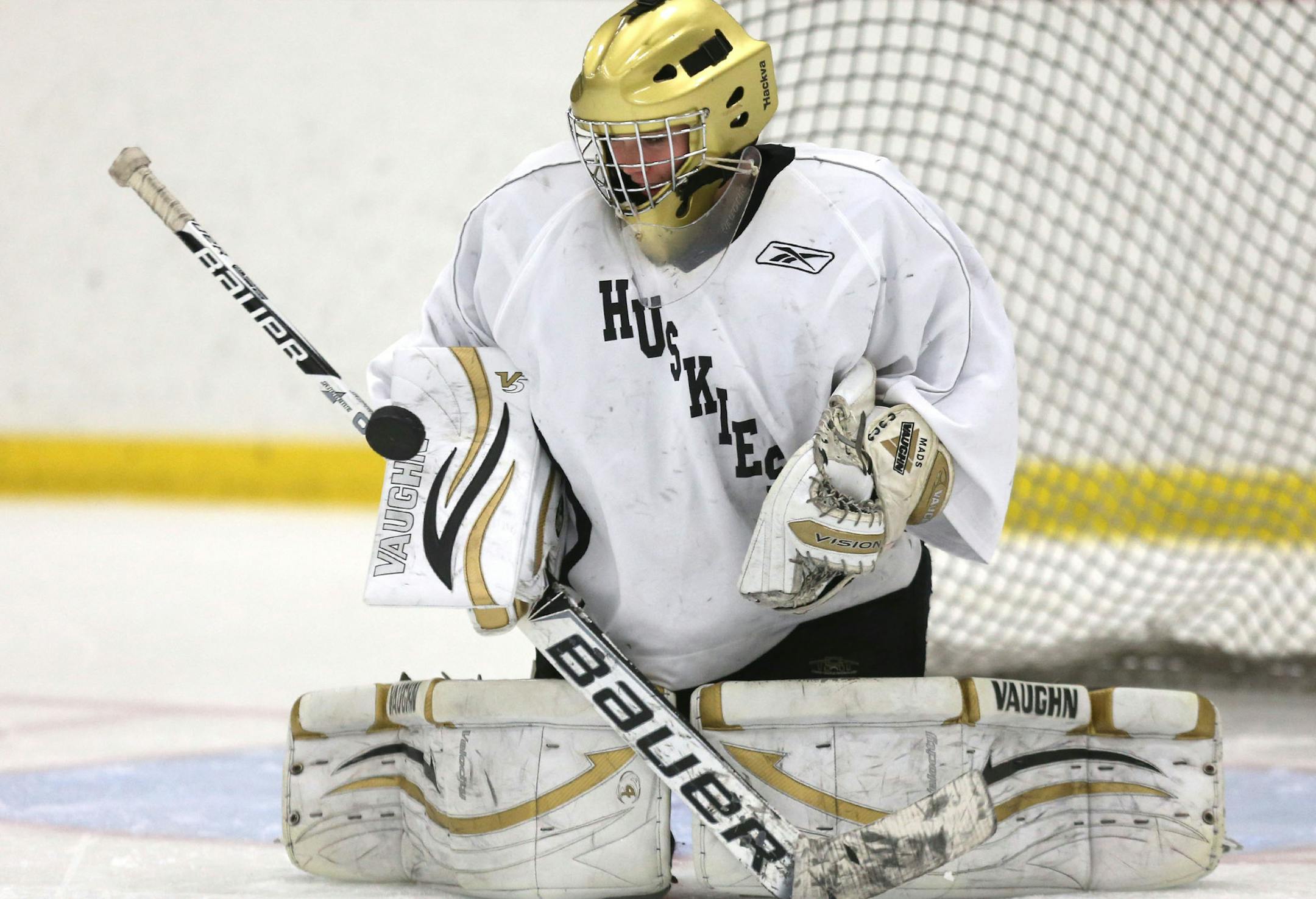 Andover goalie Maddie Rooney blocks the shot of her teammates during practice at the Andover Community Center Ice Rink in Andover, Min., Thursday, November 14, 2013 ] (KYNDELL HARKNESS/STAR TRIBUNE) kyndell.harkness@startribune.com