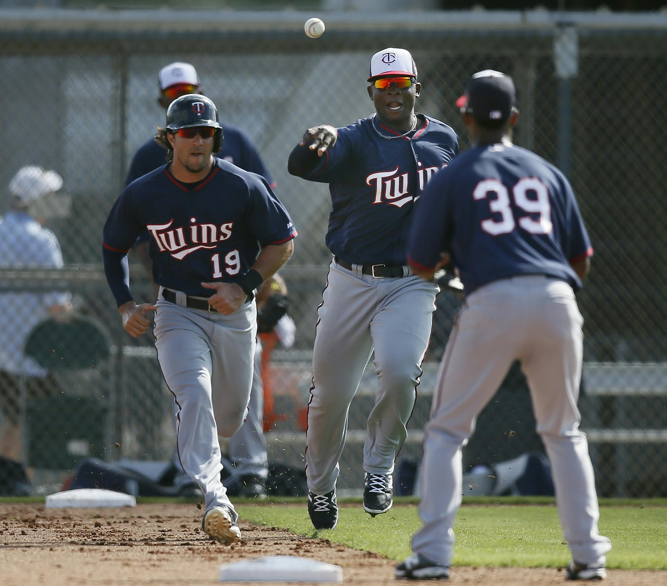 Miguel Sano, right, tossed the ball to Danny Santana as Darin Mastroianni ran the bases Monday. At 6-4 and 260 pounds, Sano has quite a size advantage over the 5-11, 190-pound Mastroianni.