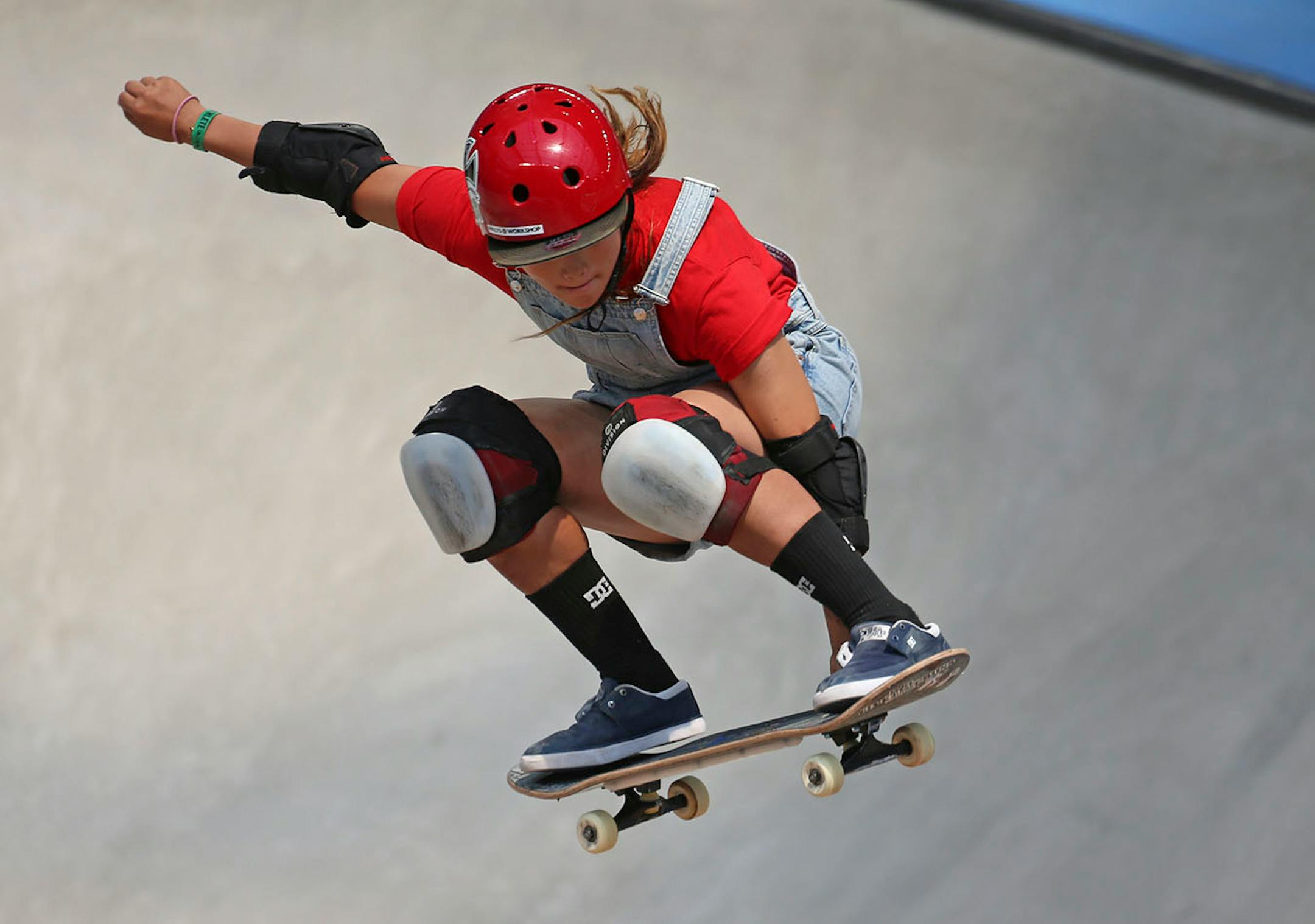 Sakura Yosozumi gets air during one of her runs in the women's skateboard park final.