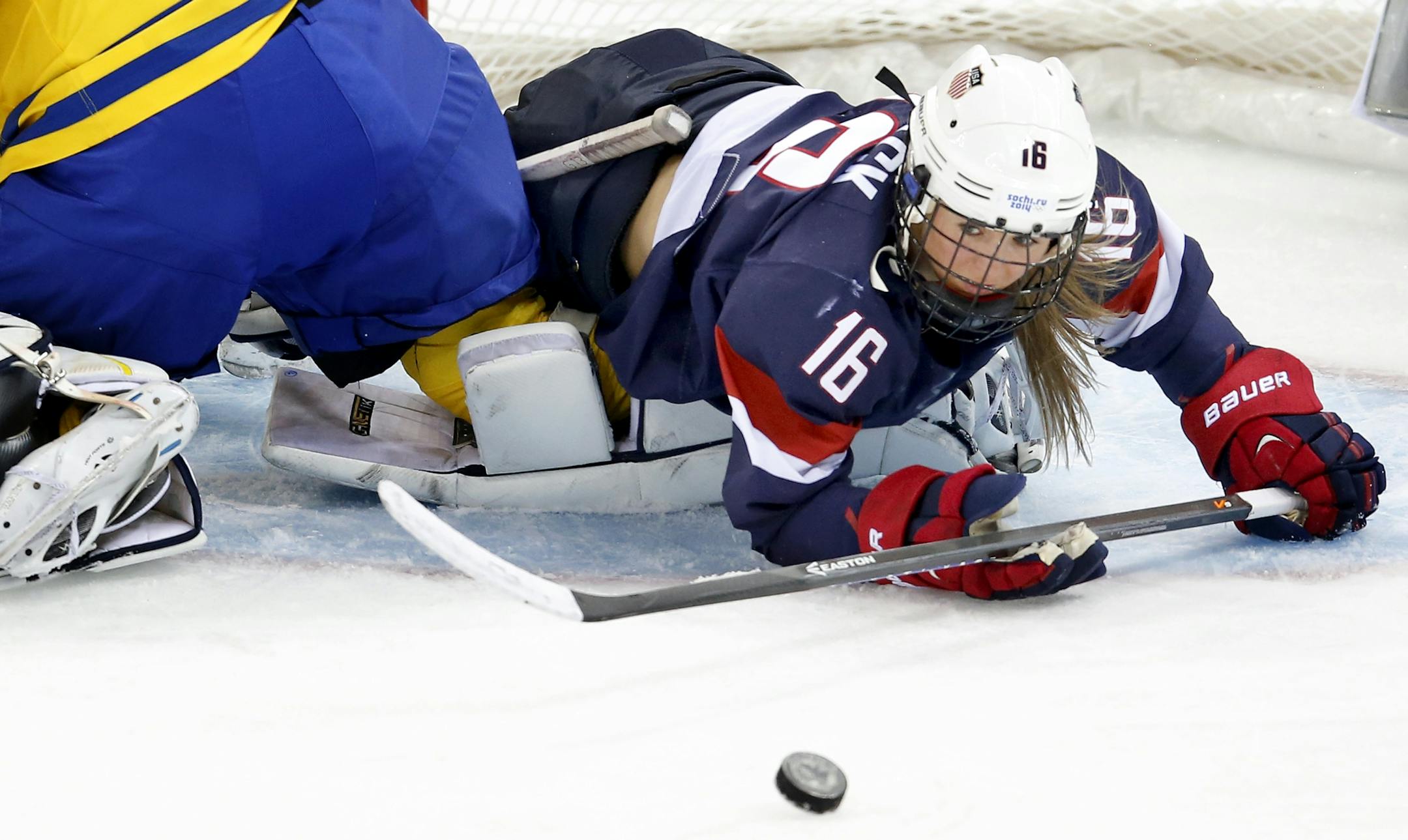 Kelli Stack (16) collided with Sweden goalie Valentina Wallner (35) in the first period. USA beat Sweden by a final score of 6-1.
