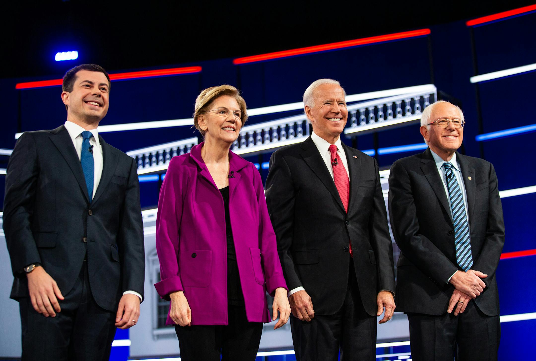 From left, Mayor Pete Buttigieg of South Bend, Ind., Sen. Elizabeth Warren (D-Mass.), former Vice President Joe Biden and Sen. Bernie Sanders (I-Vt.) take the stage before the start of the Democratic presidential debate in Atlanta, on Wednesday, Nov. 20, 2019. (Demetrius Freeman/The New York Times)
