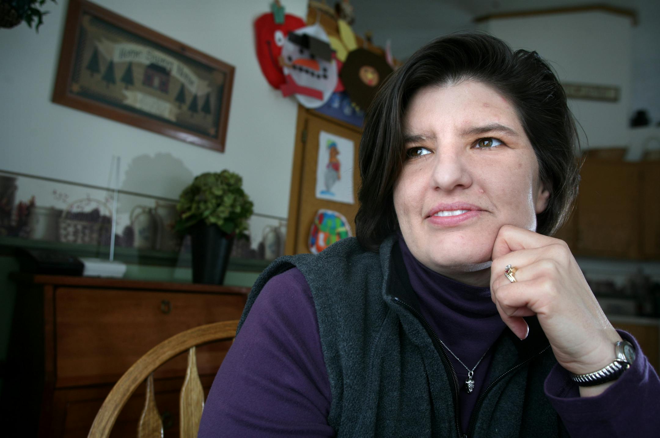 Angie Hopkins, photographed in her Oakdale home, lost her husband Tim to suicide. The couple has three young children, Alex, Noah and Nick.