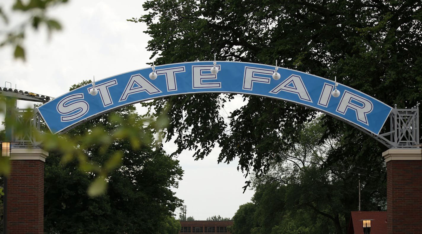 This restored blue archway sign at the Minnesota State Fairgrounds dates from the 1930s and stands in the West End Market, where Heritage Square once stood.] MONICA HERNDON monica.herndon@startribune.com Falcon Heights, MN 07/18/14 ORG XMIT: MIN1407181703183579