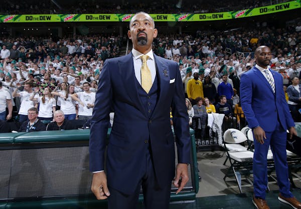 Michigan coach Juwan Howard watches before an NCAA college basketball game against Michigan State, Sunday, Jan. 5, 2020, in East Lansing, Mich. Michig