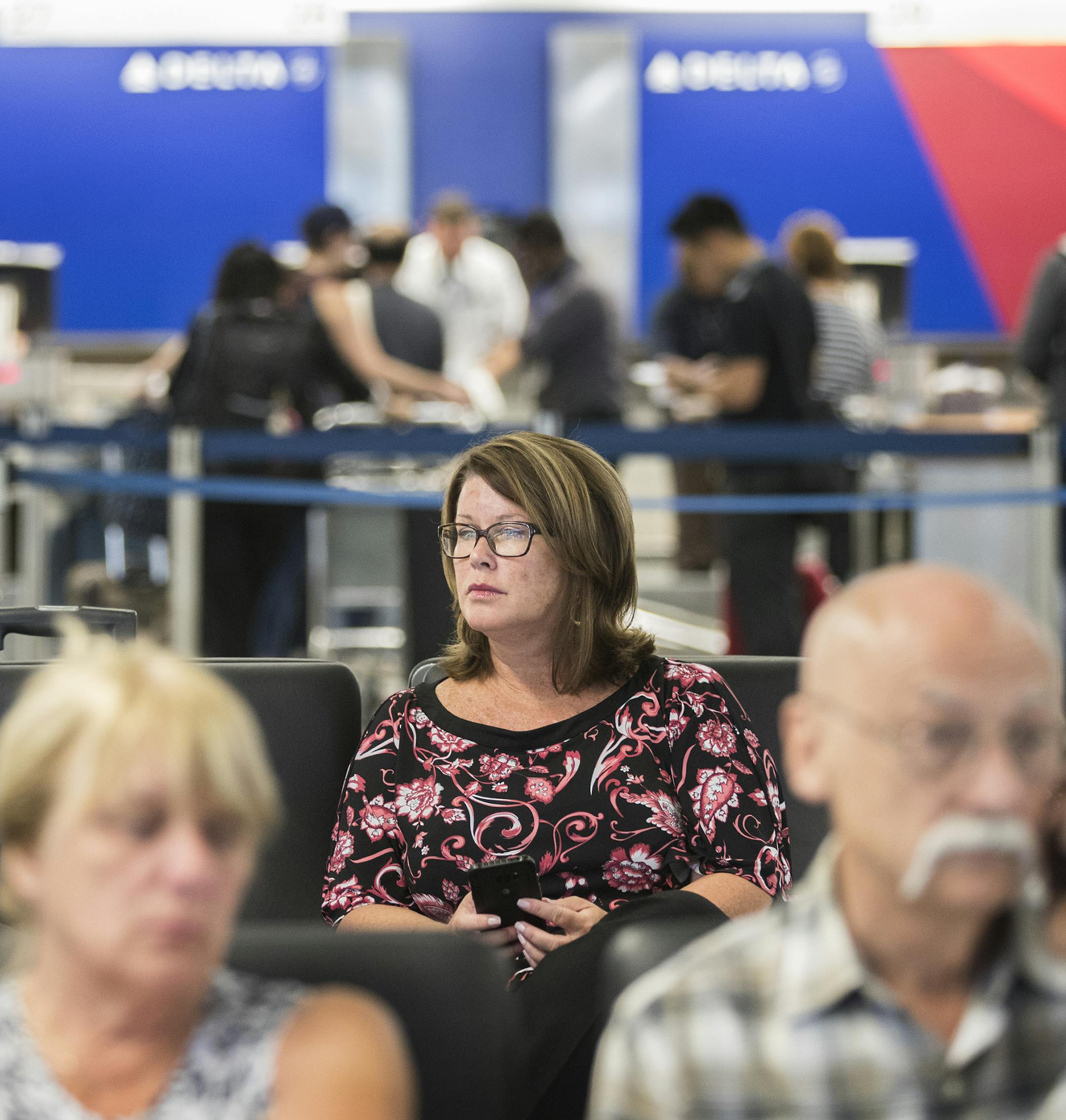 Kim Serra waits in Terminal 1 of MSP Airport on Aug. 8 for her flight to Phoenix, which was delayed an hour and a half.