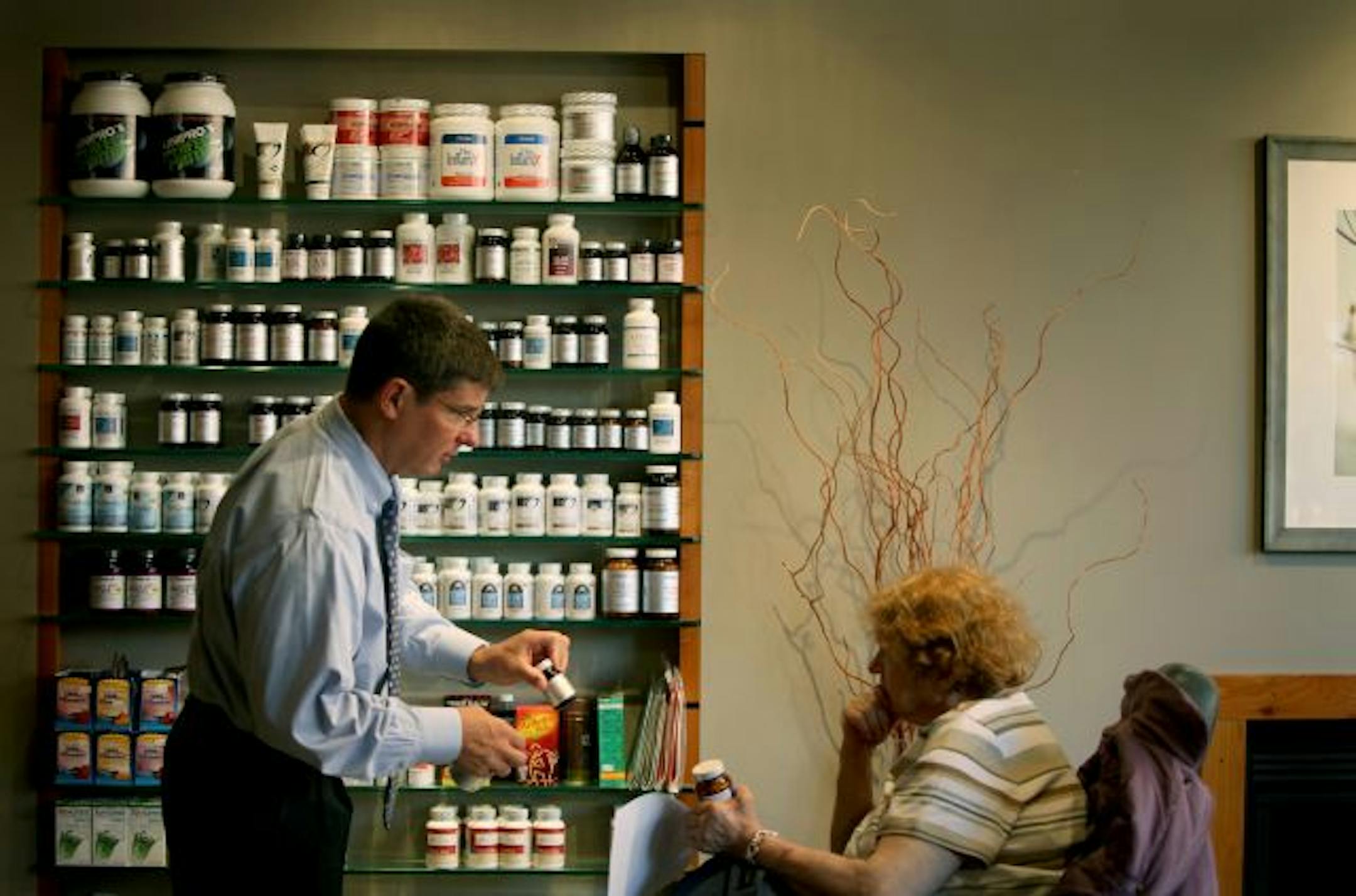 Dr. Greg Plotnikoff went over some vitamins with patient Bernice Koniar, 66, at the Penney George Clinic at Abbott Northwestern Hospital.