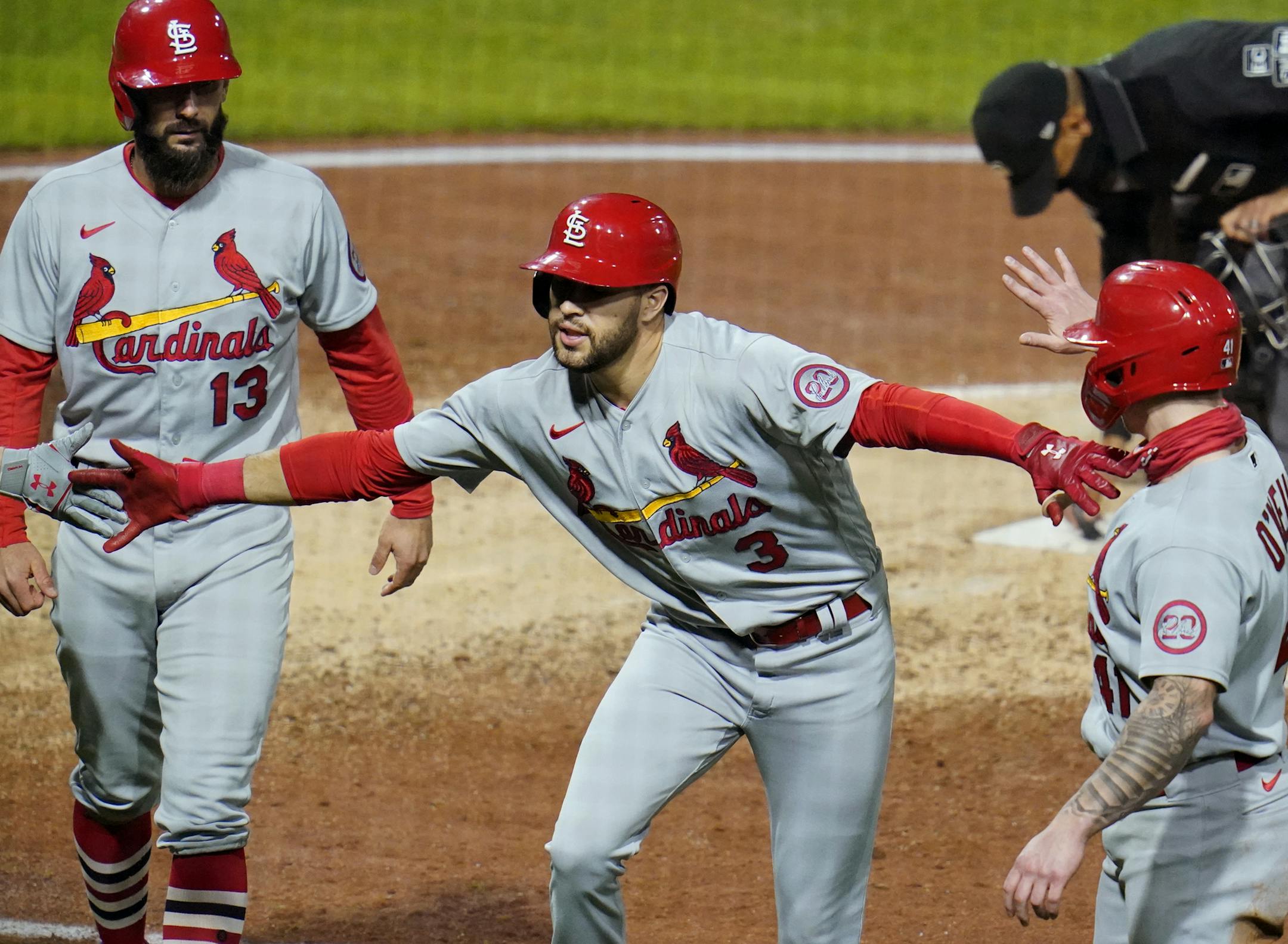 St. Louis Cardinals' Dylan Carlson celebrates as he heads to the dugout after hitting a three-run home run off Pittsburgh Pirates relief pitcher Chris Stratton during the sixth inning of the second baseball game of a doubleheader in Pittsburgh, Friday, Sept. 18, 2020. (AP Photo/Gene J. Puskar)