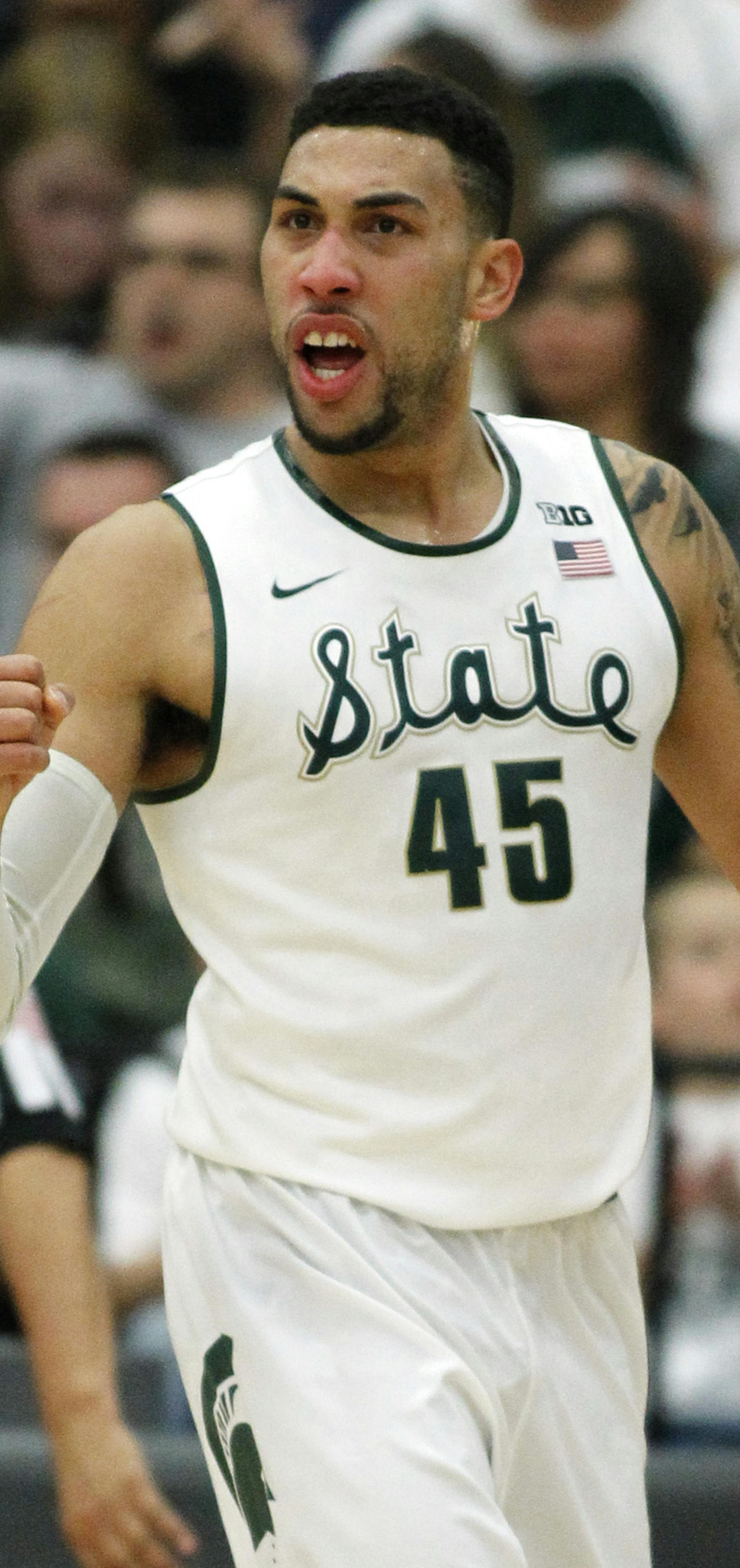 Michigan State guard Denzel Valentine (45) reacts after making a basket against Boston College during the first half of an NCAA college basketball game in the quarterfinals of the Wooden Legacy tournament, in Fullerton, Calif., Thursday, Nov. 26, 2015. (AP Photo/Alex Gallardo) ORG XMIT: CAAG118