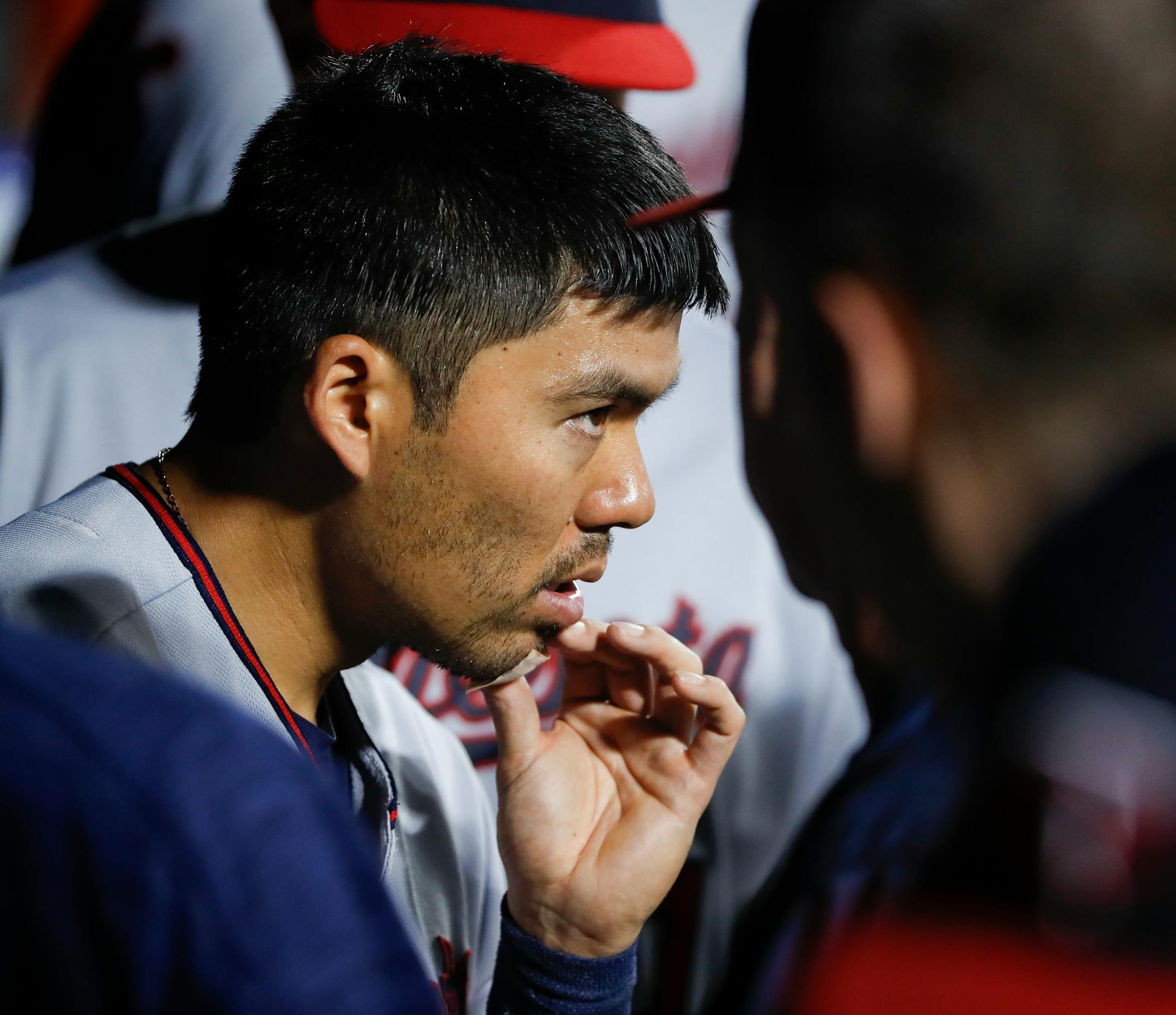 Minnesota Twins catcher Kurt Suzuki applies pressure to a bandage on his chin after being hit by a foul tip during the seventh inning of a baseball game against the New York Mets, Friday, Sept. 16, 2016, in New York. (AP Photo/Julie Jacobson)