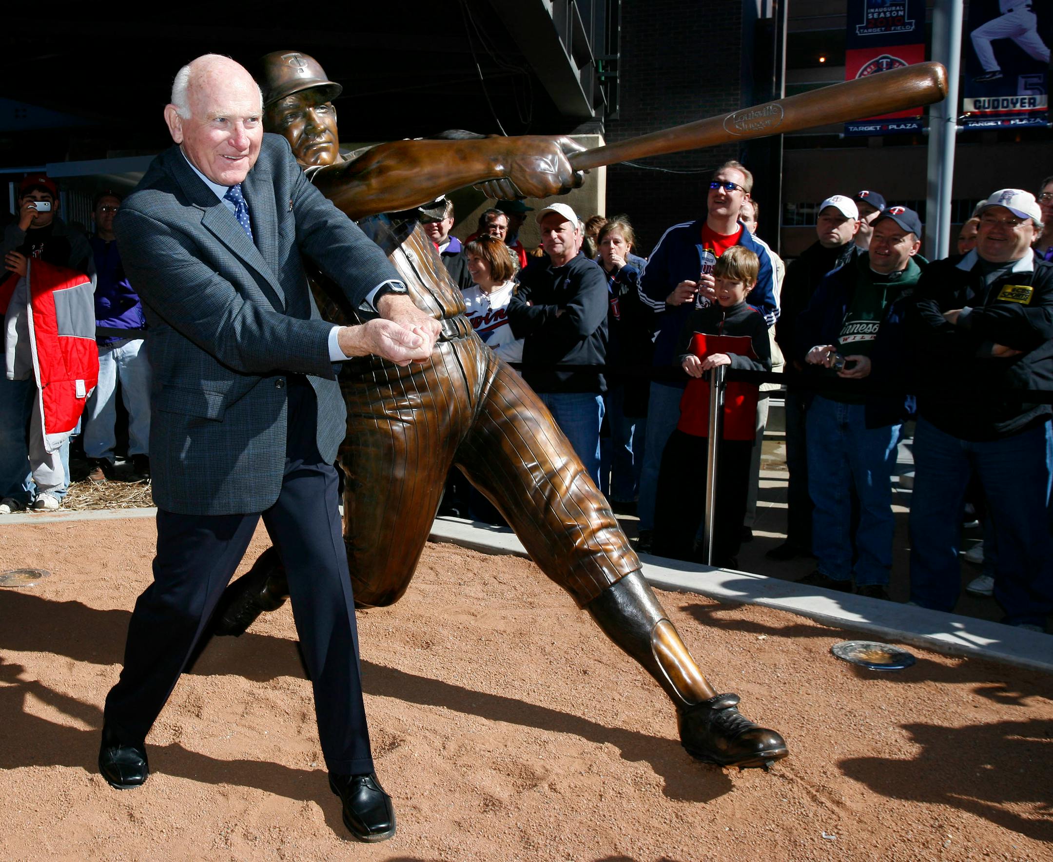 Minnesota Twins baseball player Harmon Killebrew poses with a statue of him unveiled near Target Field in Minneapolis Saturday, April 3, 2010. Killebrew, played major league baseball for 22 years and was the American MVP in 1969 and lead the Twins to the World Series in 1965.(AP Photo/Andy King)