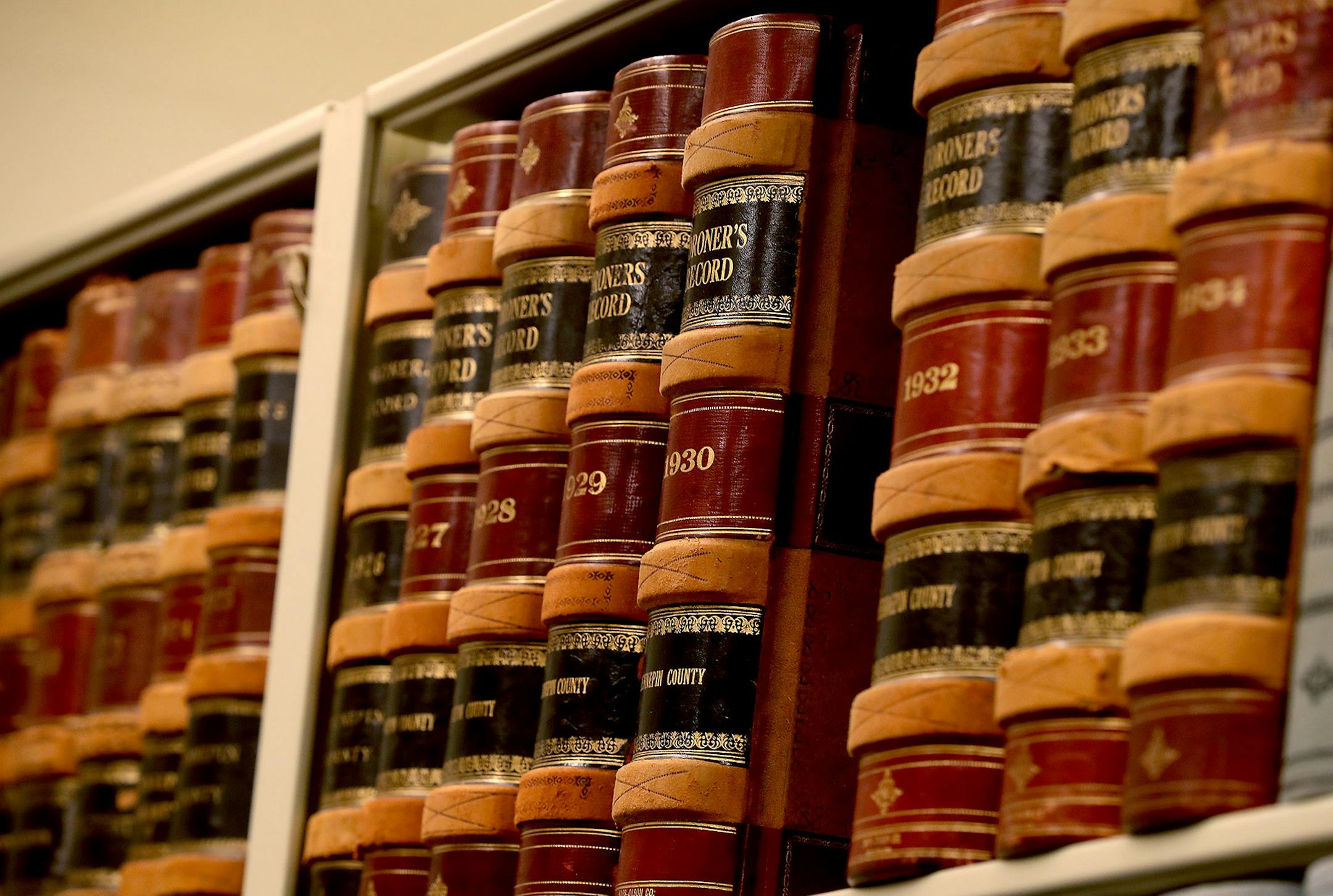 Leo Loza, left, a U of M student, and Hailey Johnson, a U of M graduate, worked on documenting information from a 1931 coroner report at the Hennepin County Medical Examiner's Office, Wednesday, July 27, 2016 in Minneapolis, MN. Researchers, who are all students, are getting a rare look into documents from the past 110 years, indexing the deaths for the Medical Examiner's Office and tracking homicide trends. ] (ELIZABETH FLORES/STAR TRIBUNE) ELIZABETH FLORES • eflores@startribune.com