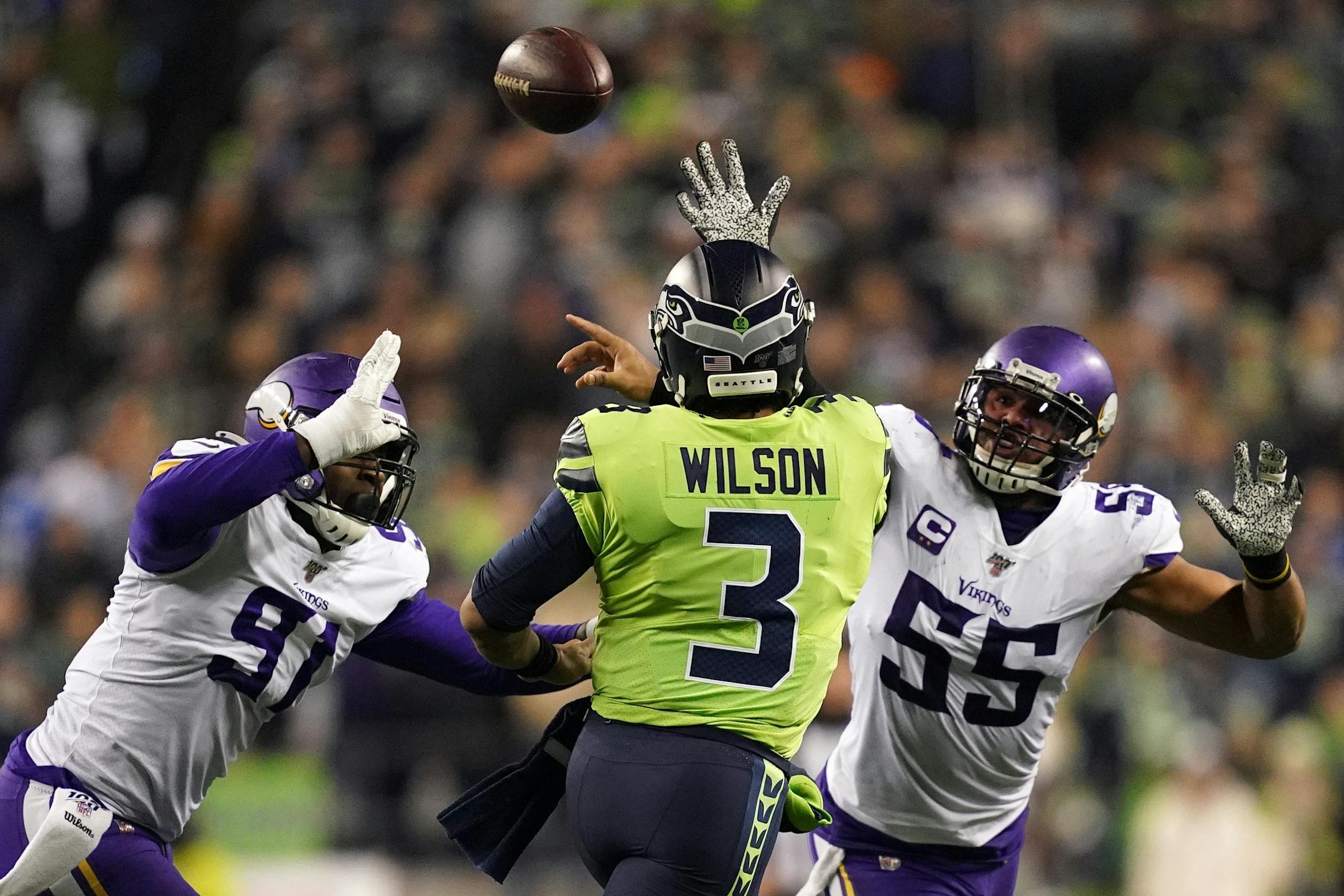 Seahawks quarterback Russell Wilson (3) threw under pressure from Vikings defensive end Stephen Weatherly (91) and Vikings outside linebacker Anthony Barr (55) in the fourth quarter.