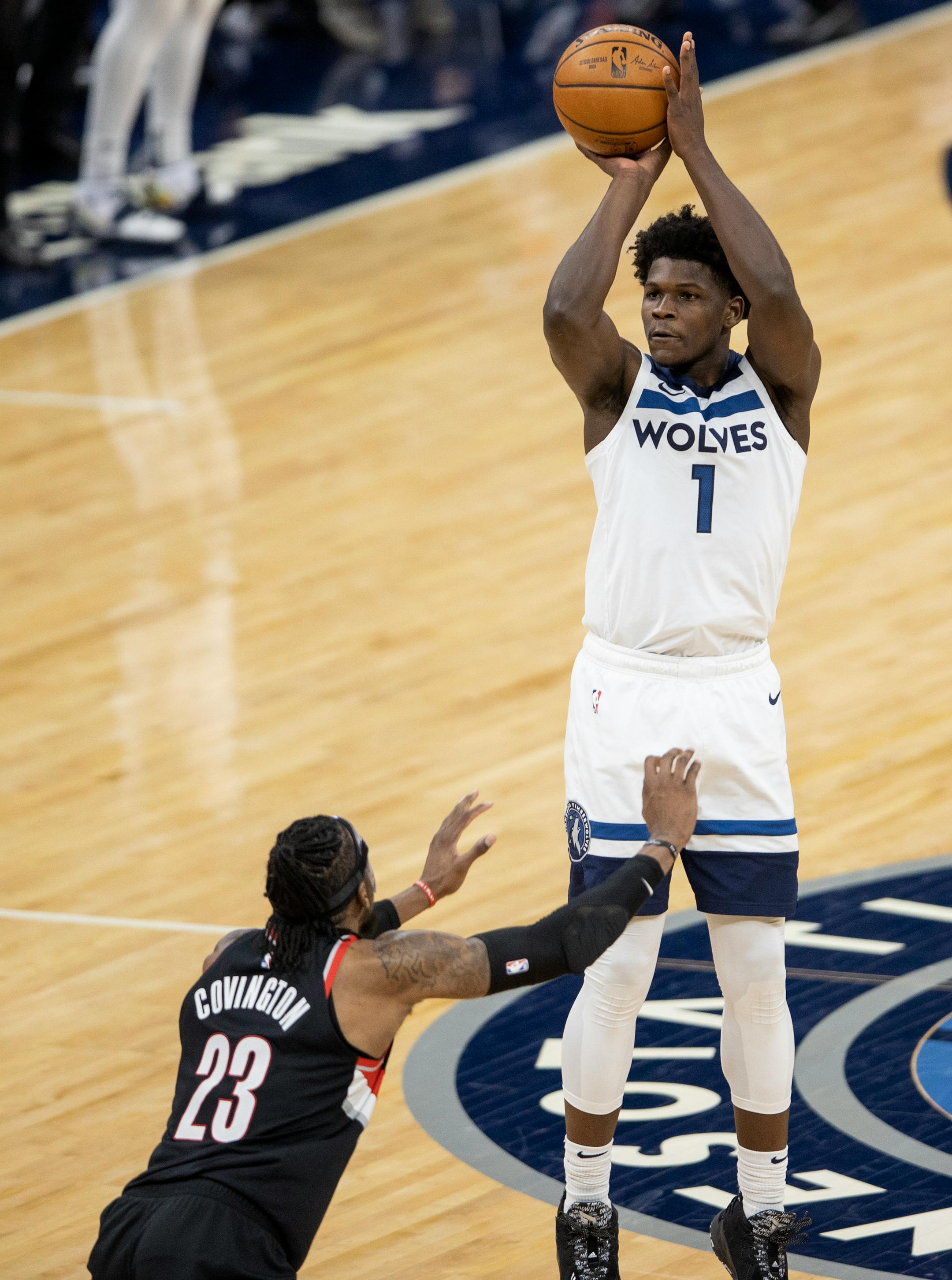 Anthony Edwards (1) ) of the Minnesota Timberwolves attempted a shot while defended by Robert Covington (23) of the Portland Trailblazers in the fourth quarter.