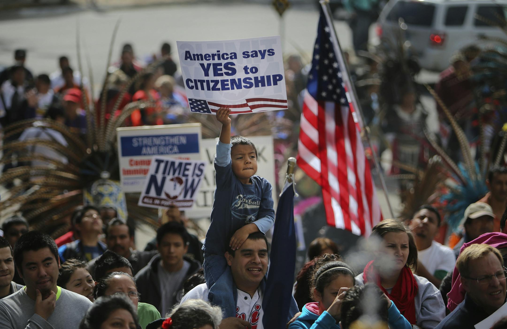 A father and son were among the thousands rallying outside the Basilica of St. Mary before the group marched on to the Hennepin County Government Center Plaza Saturday, Oct. 5, 2013, in Minneapolis, MN.](DAVID JOLES/STARTRIBUNE) djoles@startribune.com Thousands of immigration reformers from Minnesota&#x201a;&#xc4;&#xf4;s business, faith, labor, education, and immigrant communities staged a massive rally and march Saturday, Oct. 5, 2013, to urge the House of Representatives to pass immigration re