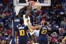 New Orleans Pelicans forward Zion Williamson (1) dunks over Utah Jazz center Rudy Gobert (27) during the second half of a preseason NBA basketball gam