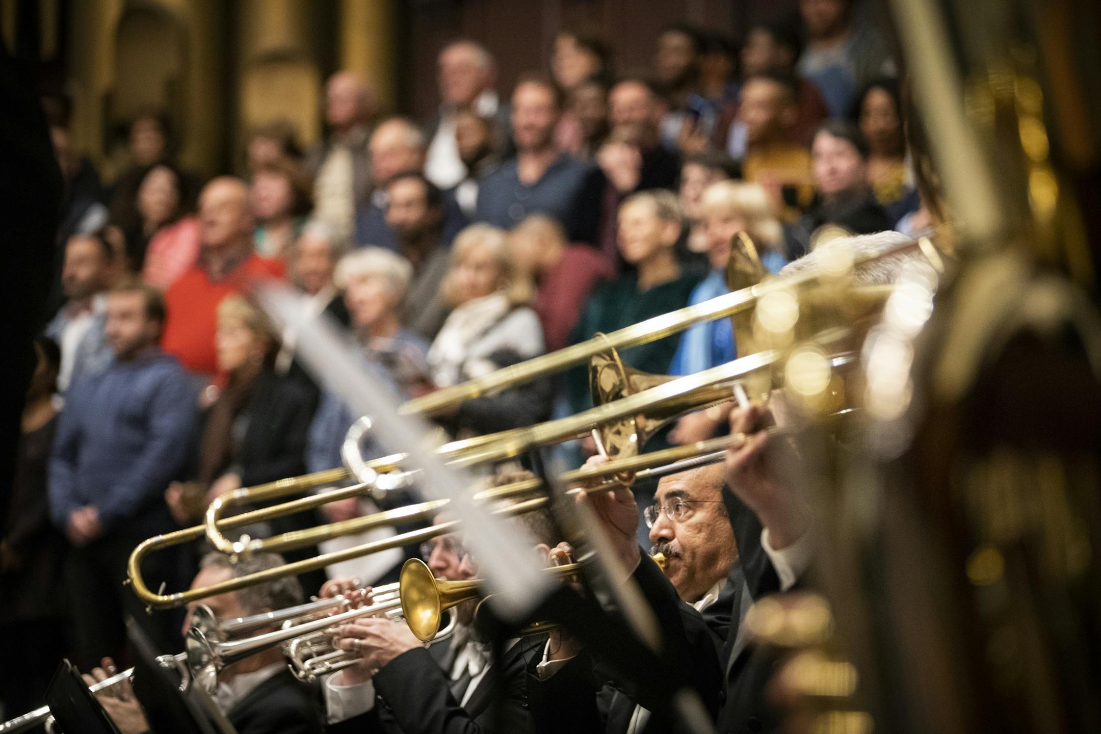 Trumpet player Manny Laureano and the orchestra play the National Anthem of the United States.